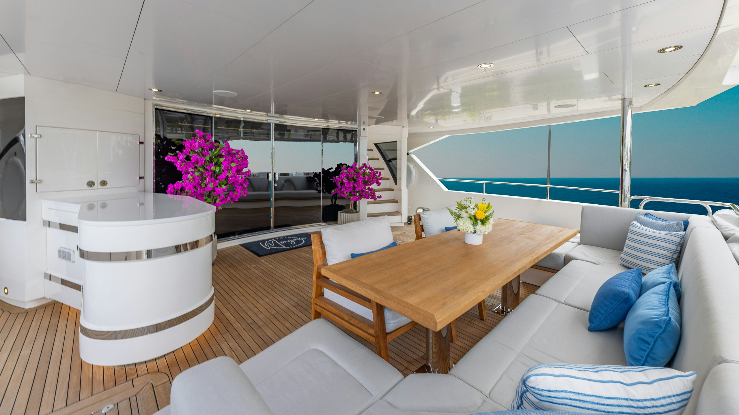 a room with a table and chairs aboard CAPTAIN MORGAN III Yacht for Charter