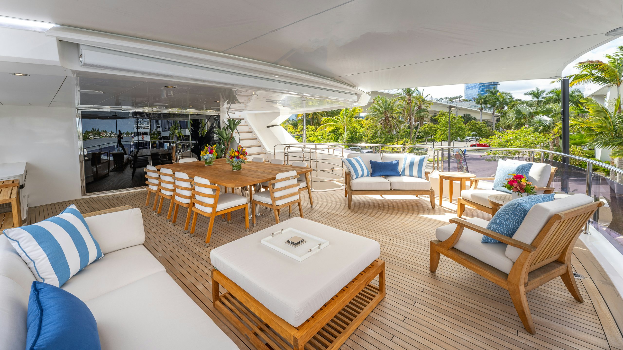 a large living room with a table and chairs aboard CAPTAIN MORGAN III Yacht for Charter