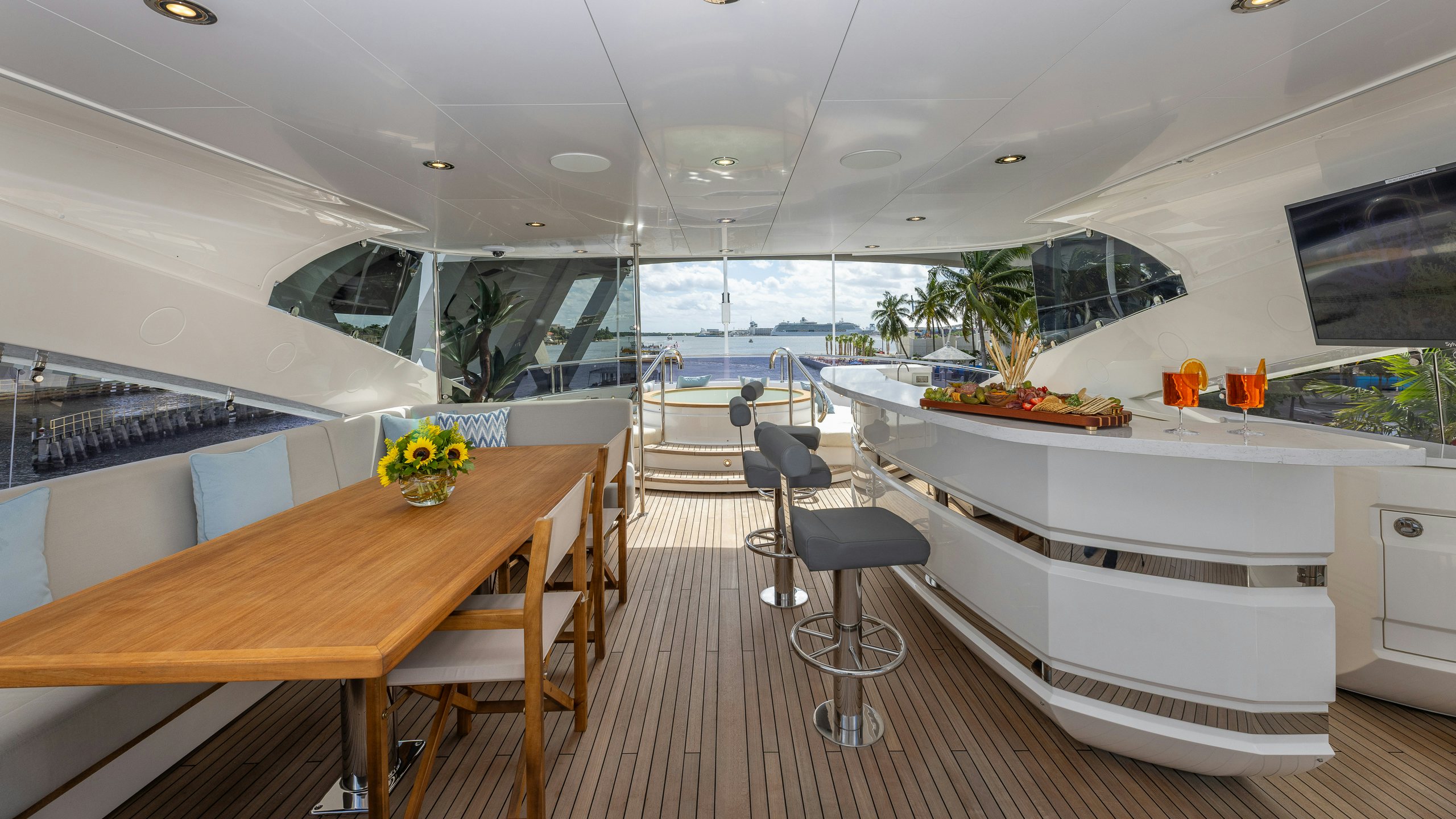 a modern kitchen with a large table aboard CAPTAIN MORGAN III Yacht for Charter