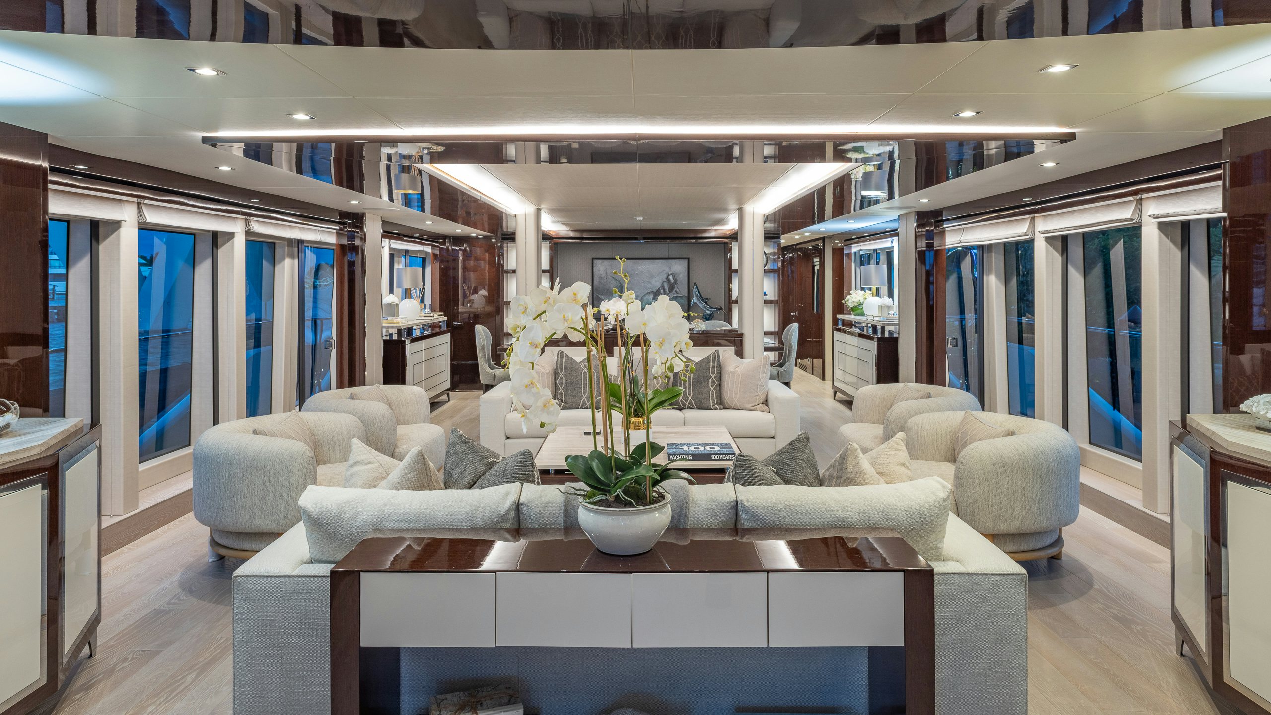 a living room with a table and chairs aboard CAPTAIN MORGAN III Yacht for Charter