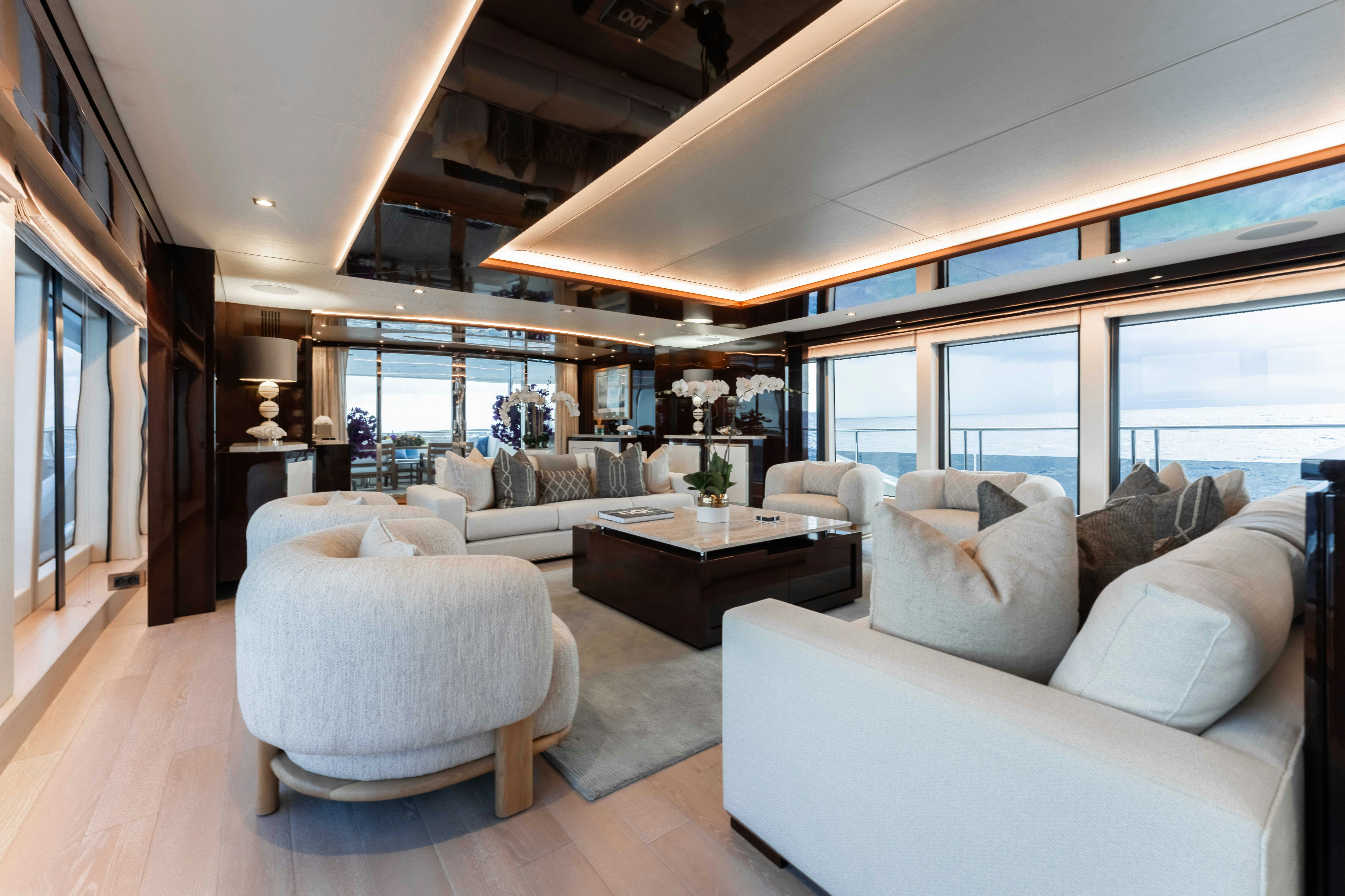 a living room with a large window aboard CAPTAIN MORGAN III Yacht for Charter