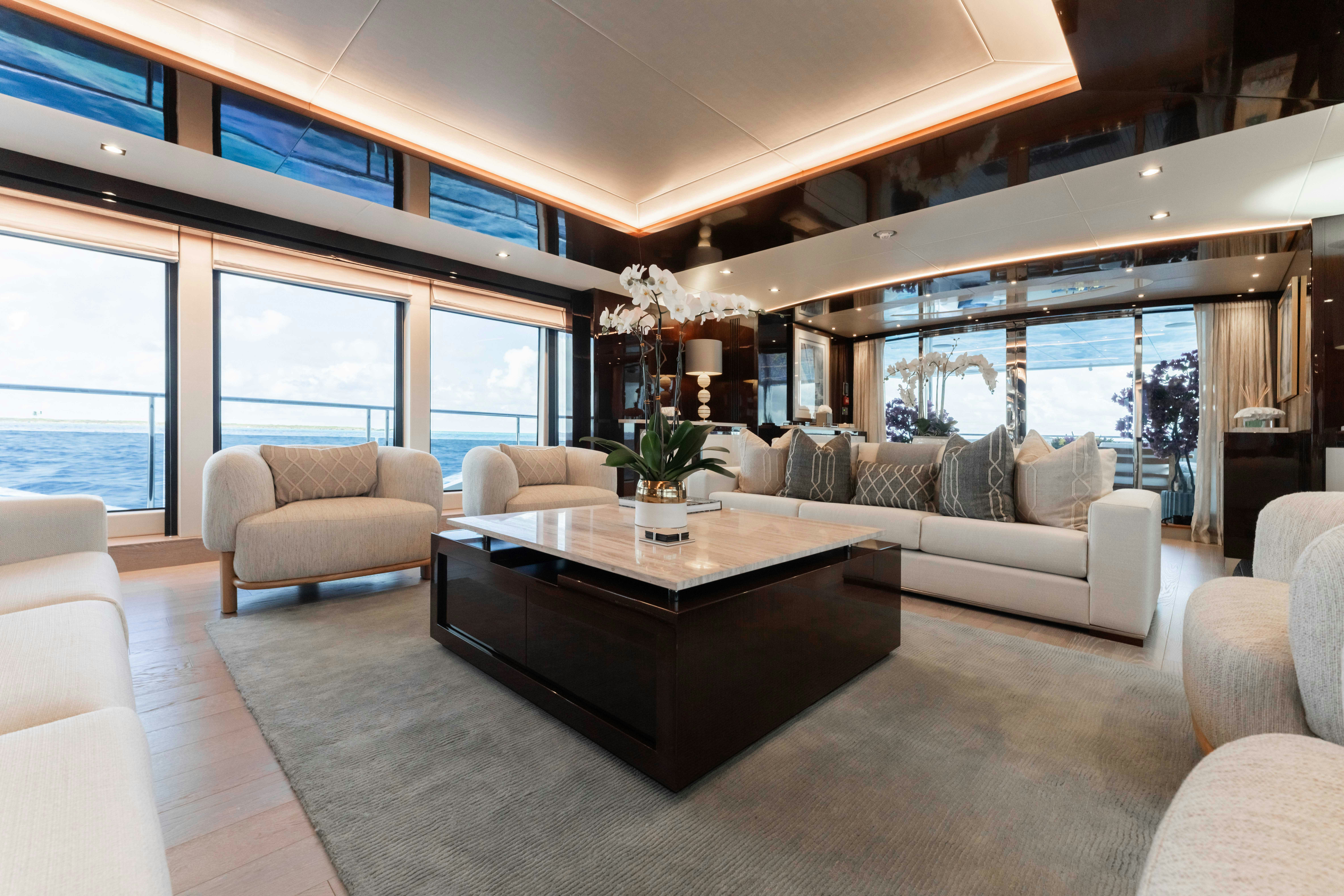 a living room with a large window aboard CAPTAIN MORGAN III Yacht for Charter