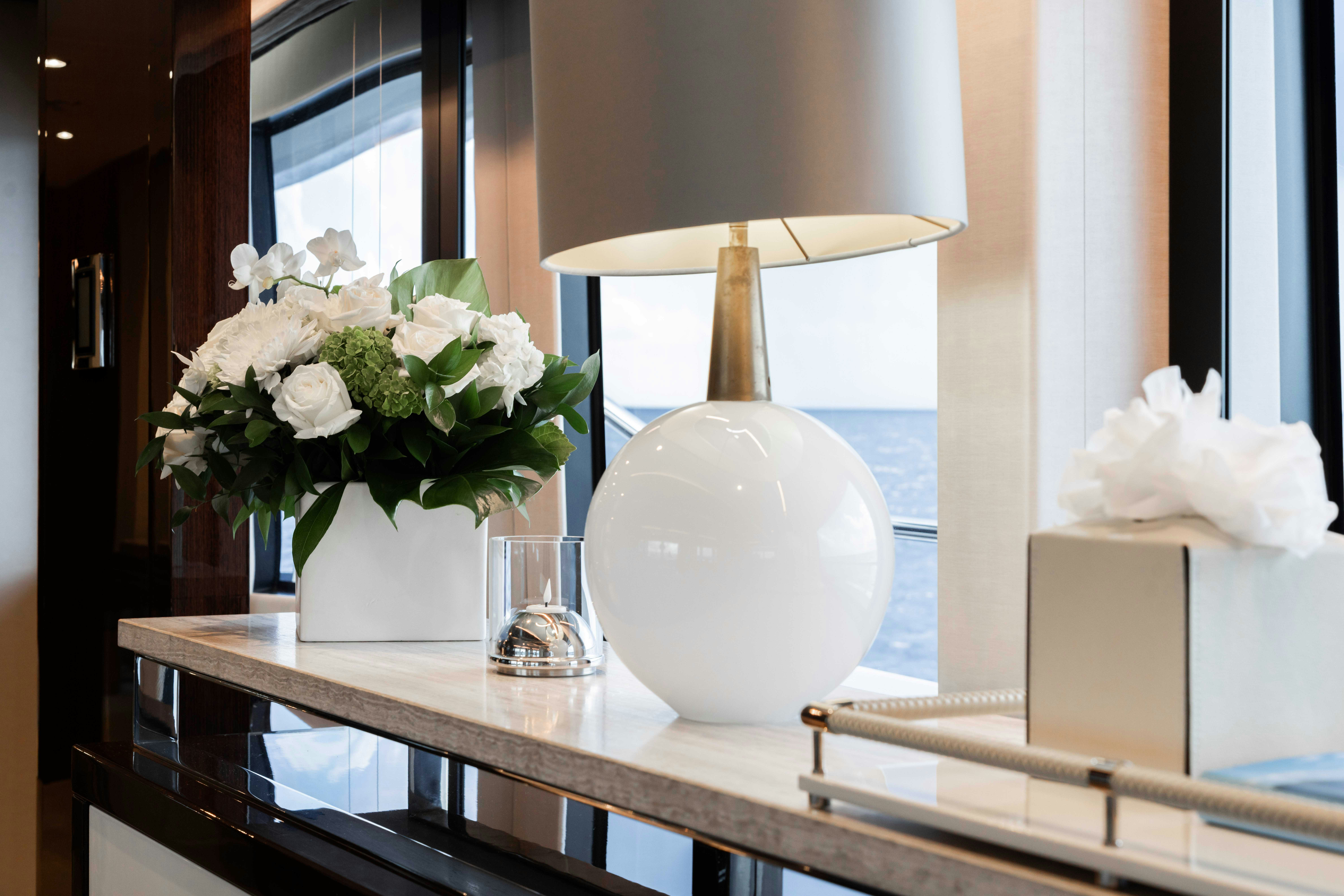 a white lamp on a table aboard CAPTAIN MORGAN III Yacht for Charter