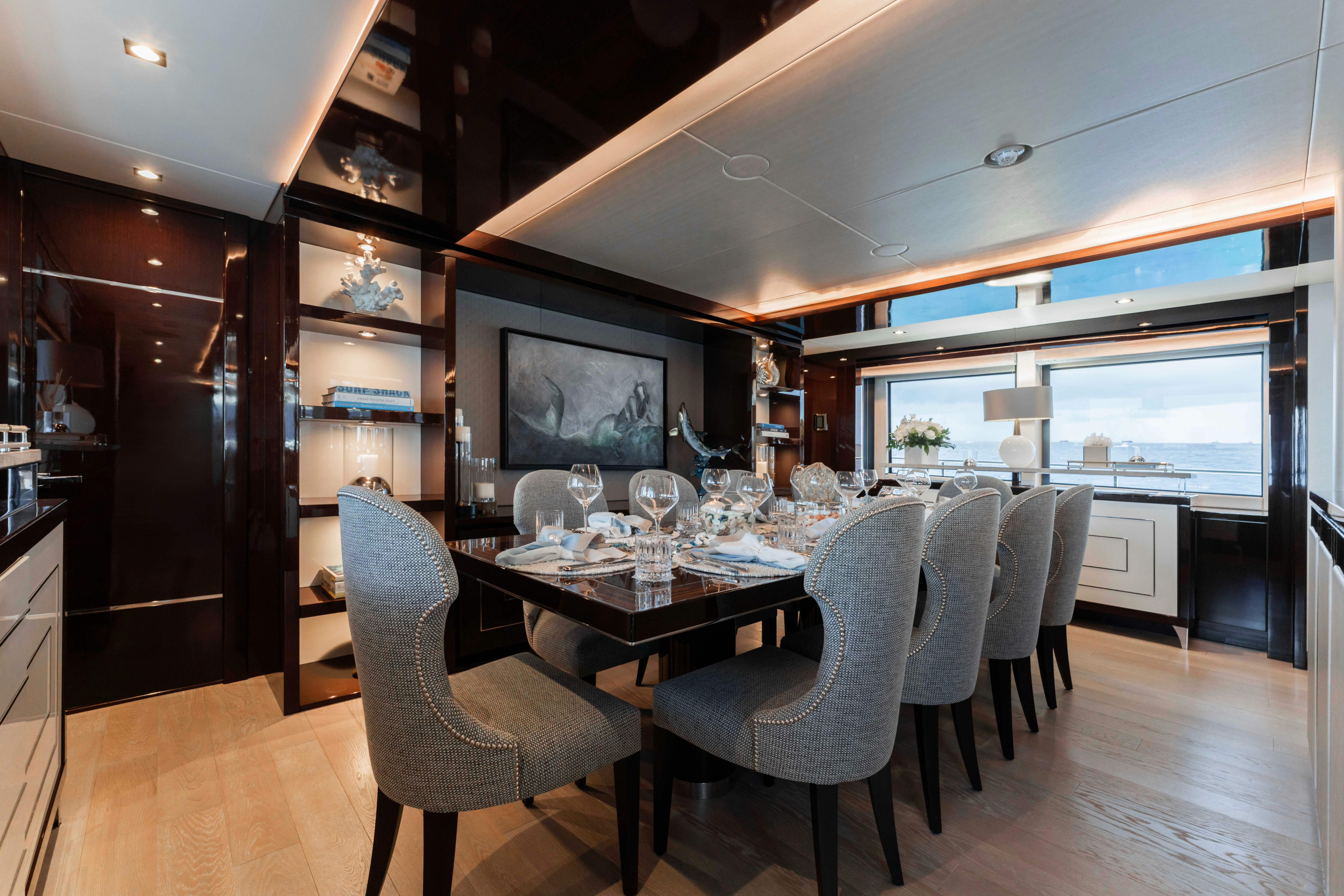 a dining room with a large table aboard CAPTAIN MORGAN III Yacht for Charter