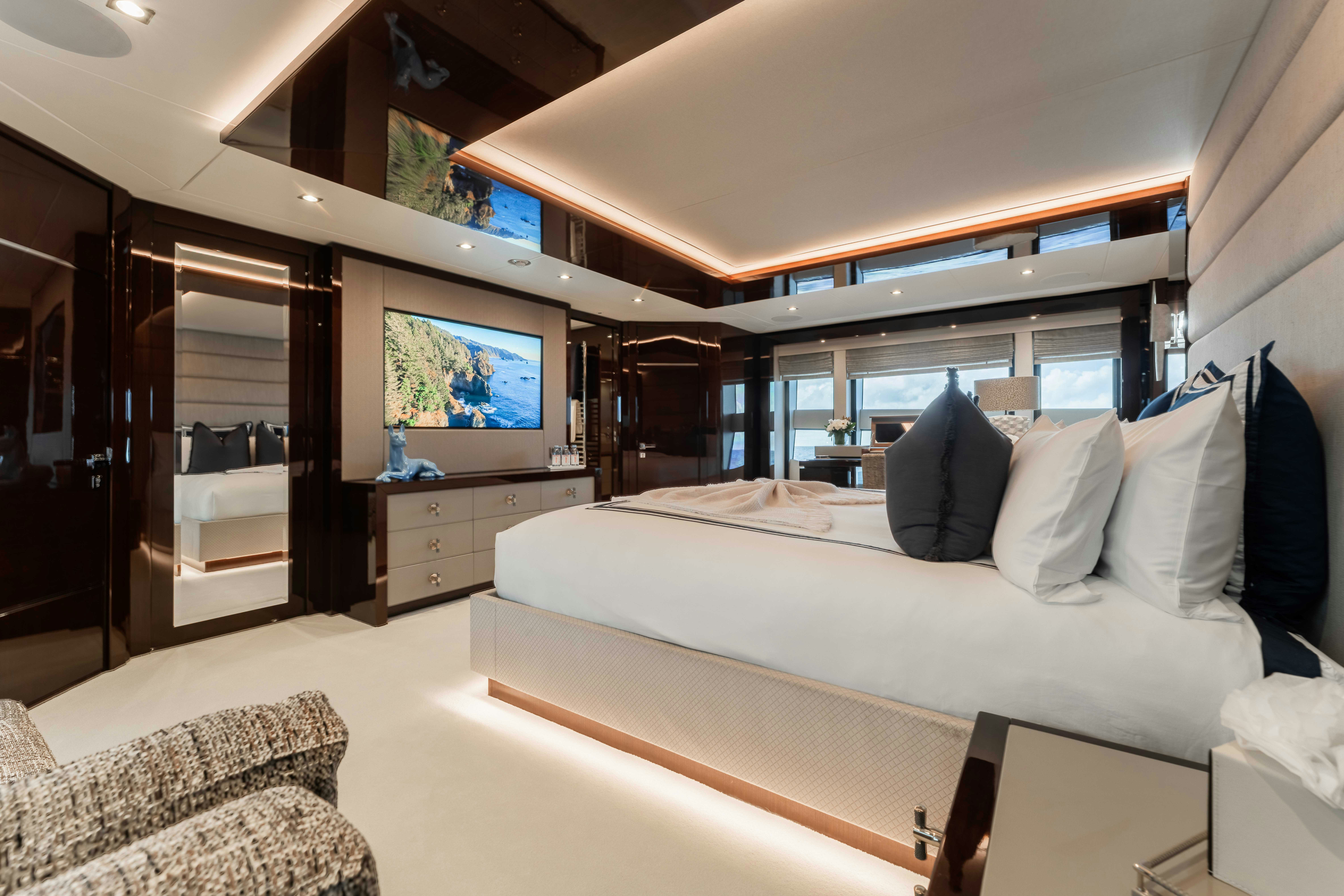 a bedroom with a large bed aboard CAPTAIN MORGAN III Yacht for Charter