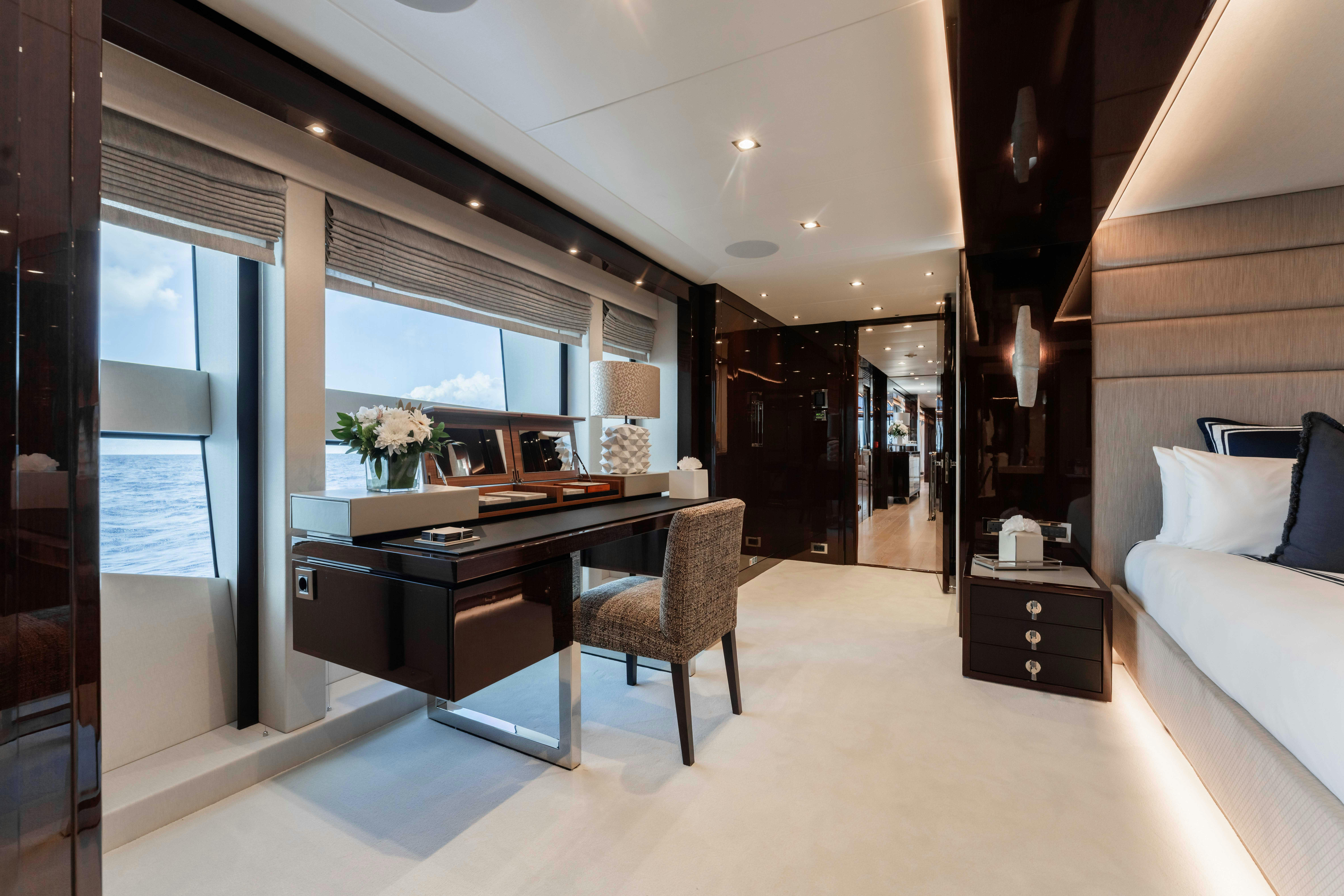 a room with a desk and a couch aboard CAPTAIN MORGAN III Yacht for Charter