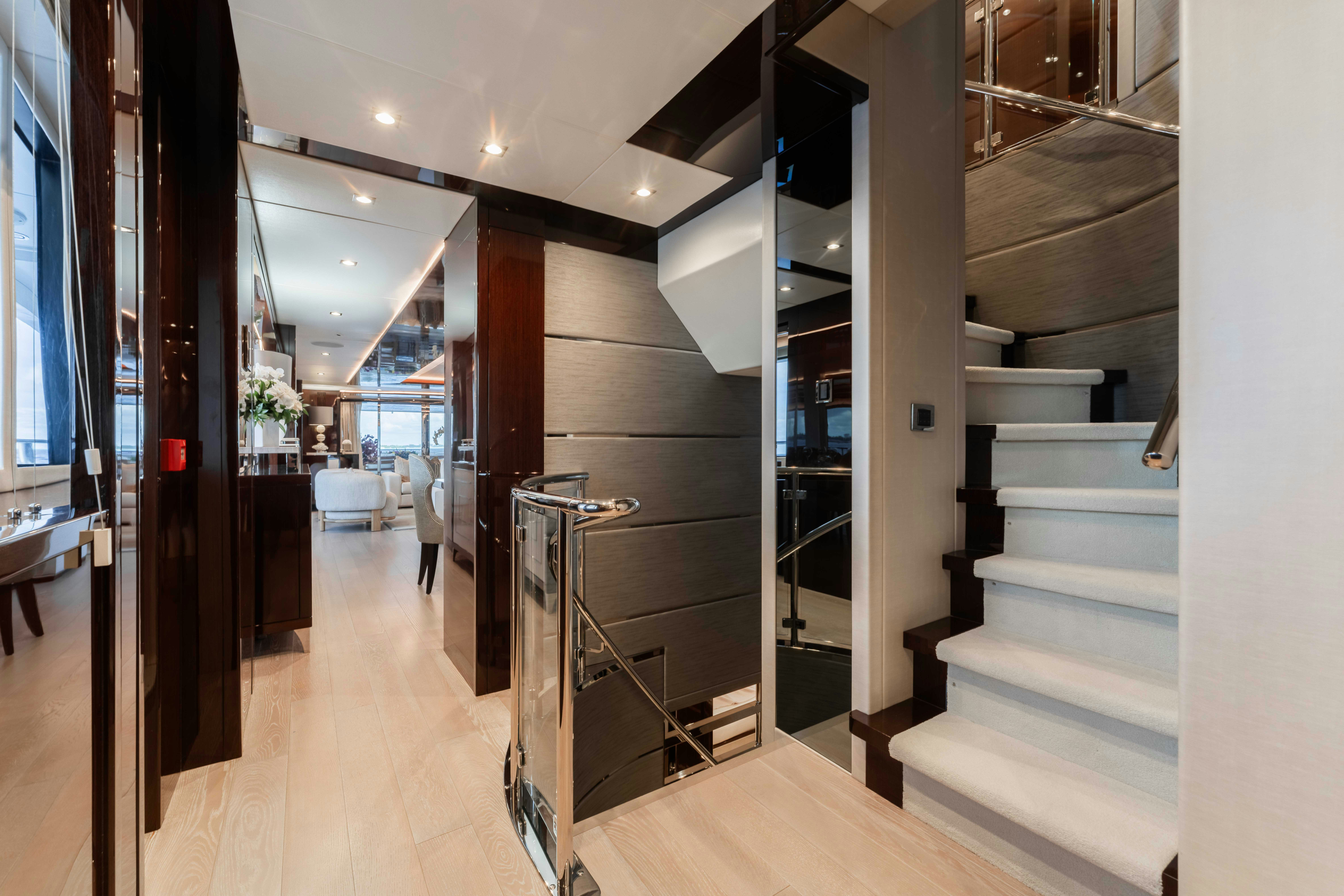 a long hallway with stairs aboard CAPTAIN MORGAN III Yacht for Charter