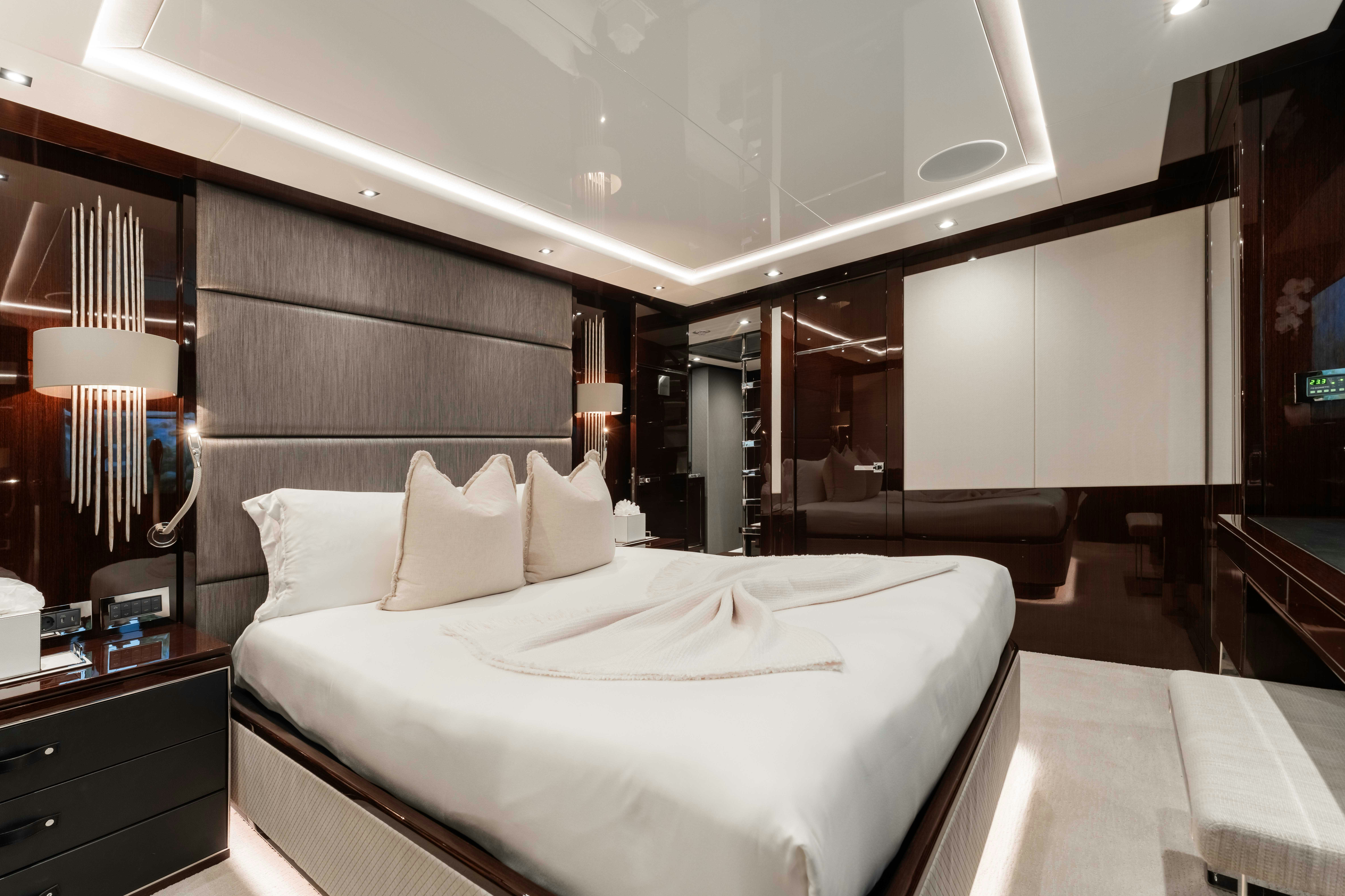 a hotel room with a bed aboard CAPTAIN MORGAN III Yacht for Charter