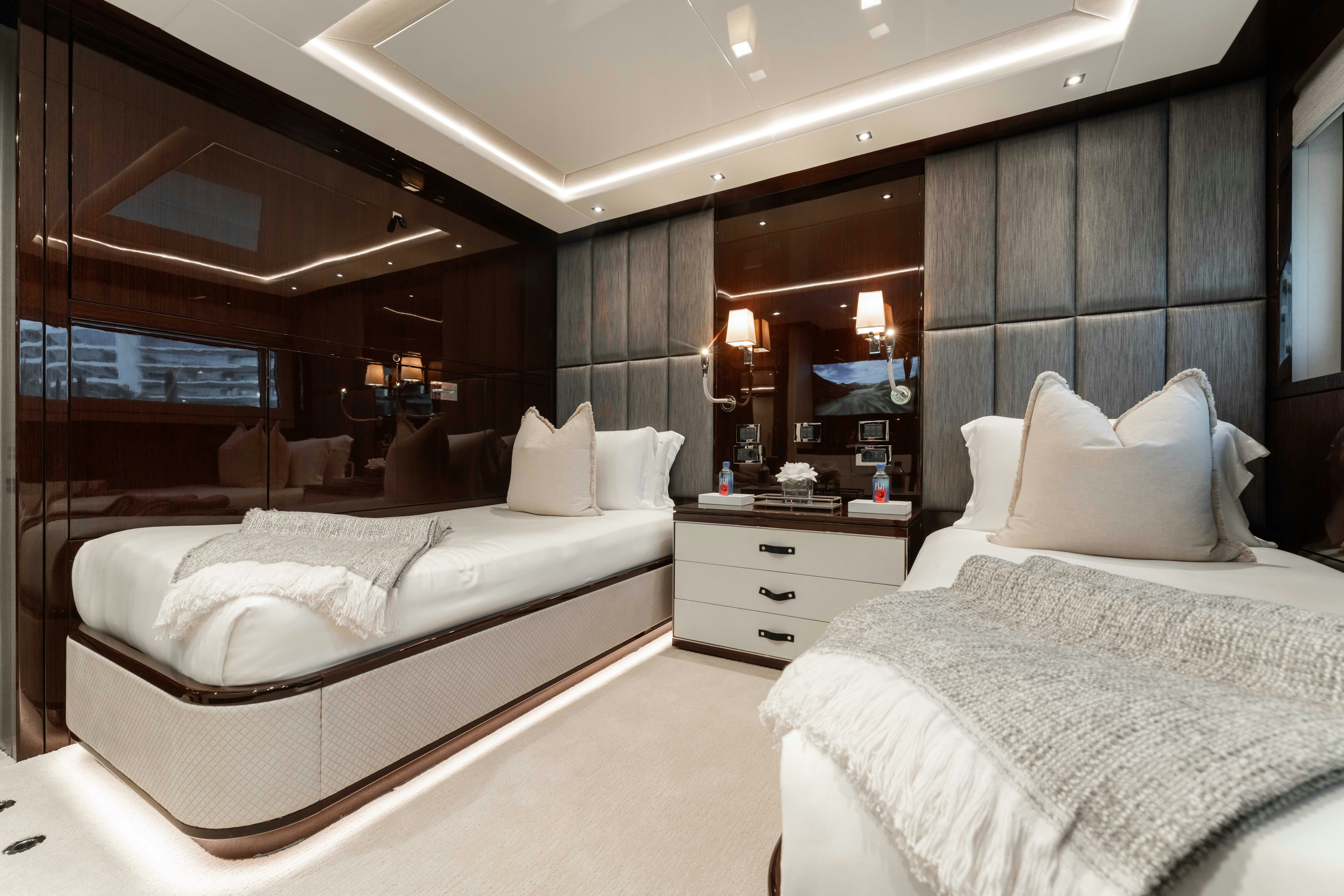 a room with two beds aboard CAPTAIN MORGAN III Yacht for Charter