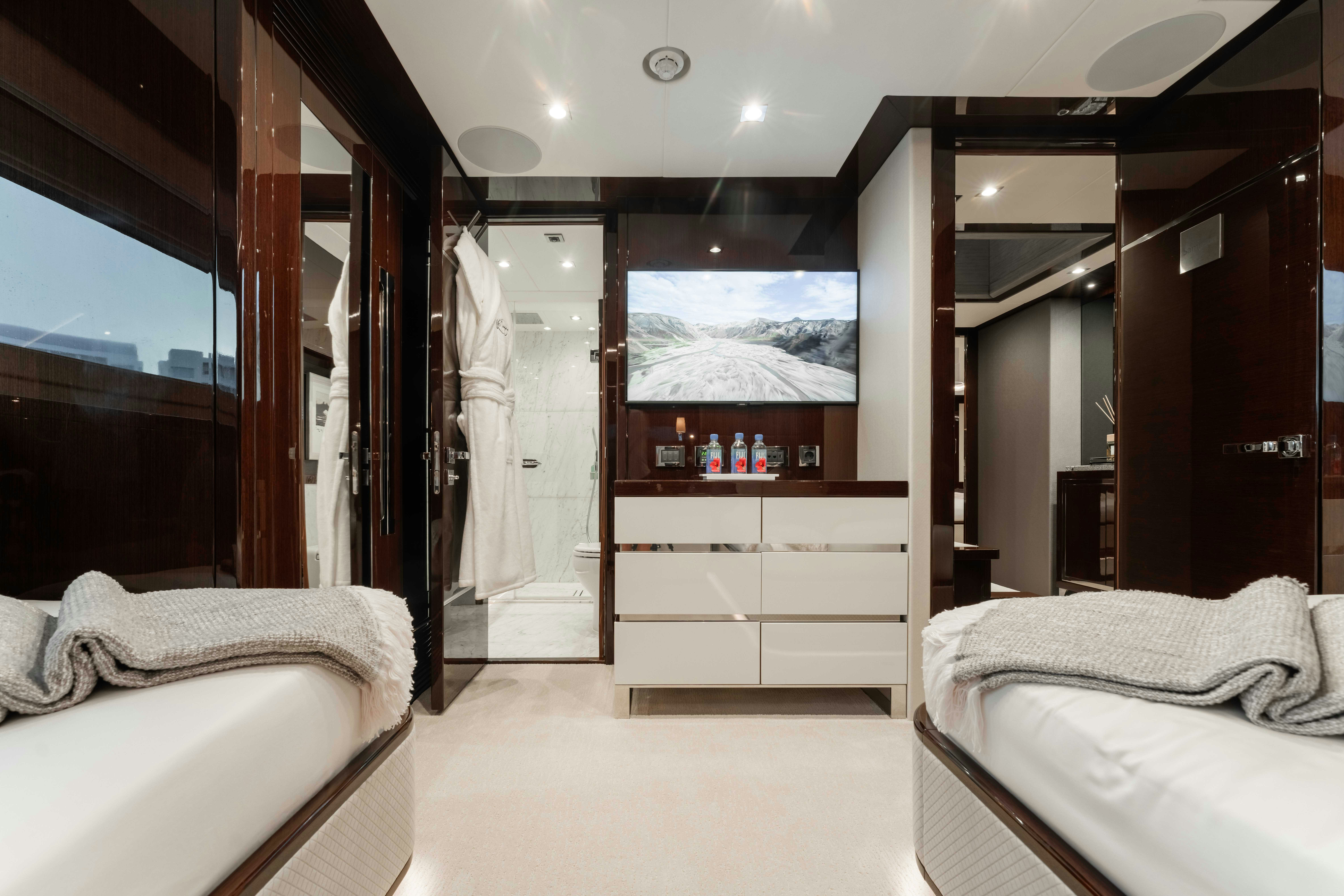 a room with a bed and a large mirror aboard CAPTAIN MORGAN III Yacht for Charter