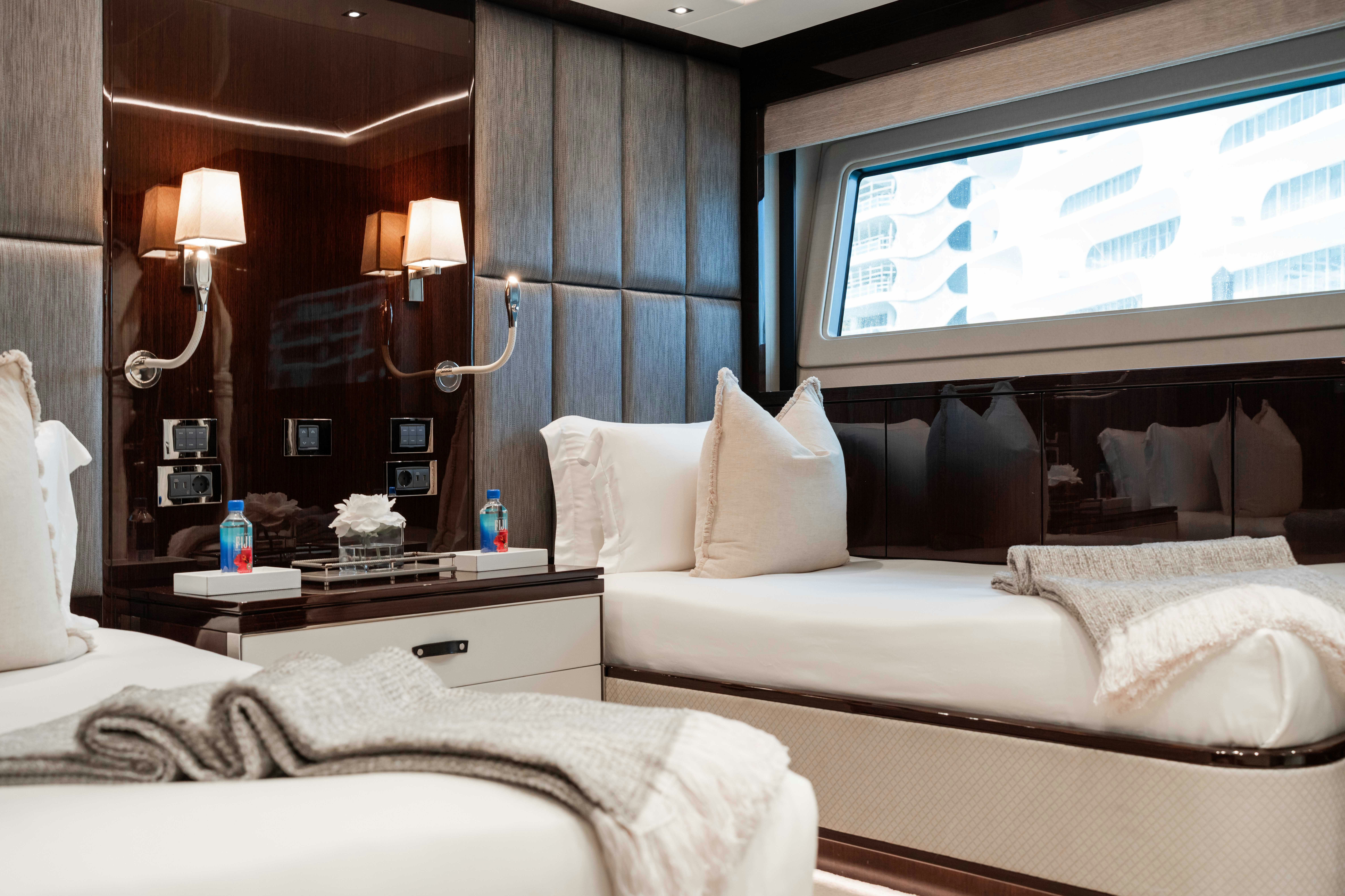 a room with two beds aboard CAPTAIN MORGAN III Yacht for Charter