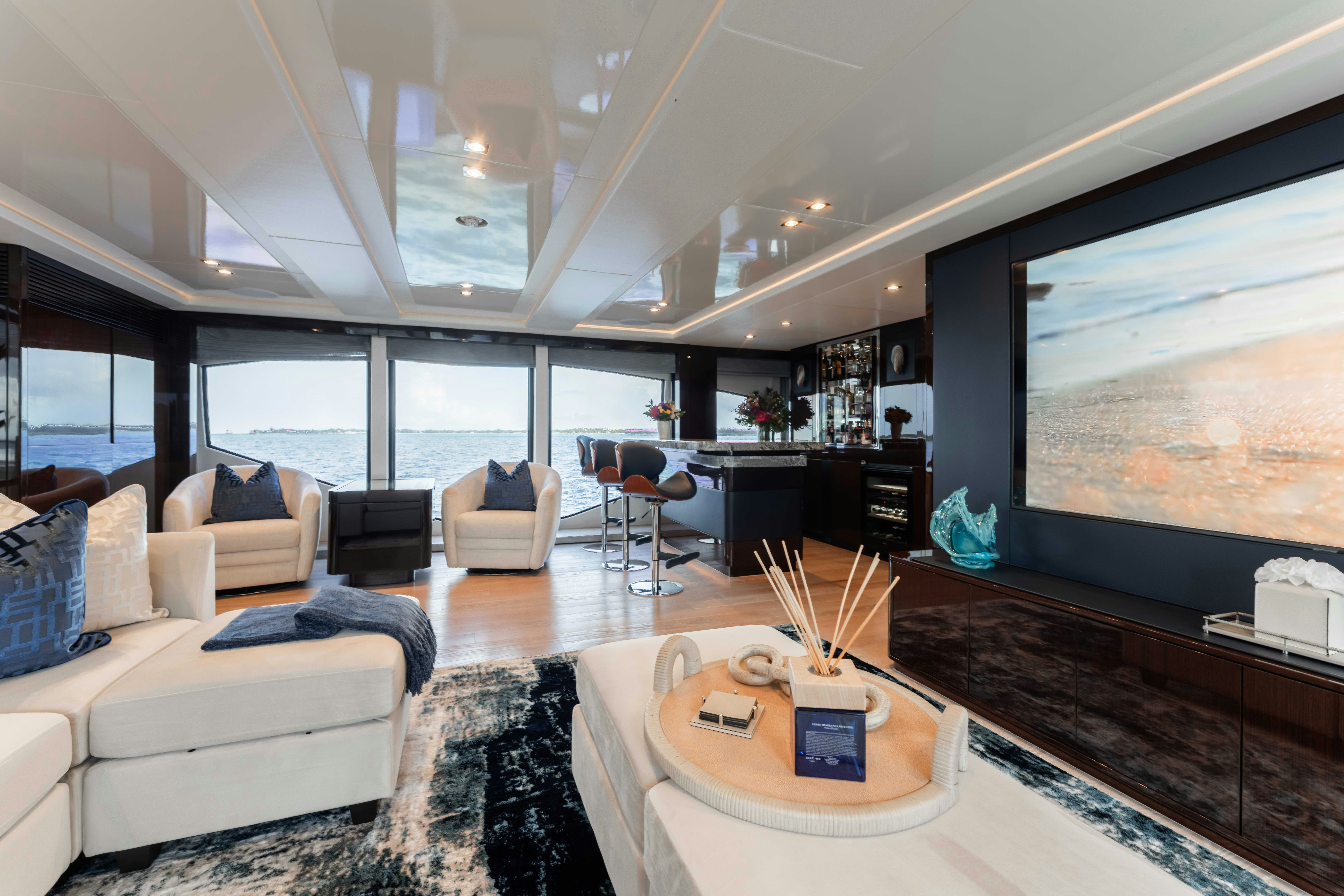 a living room with a large screen aboard CAPTAIN MORGAN III Yacht for Charter