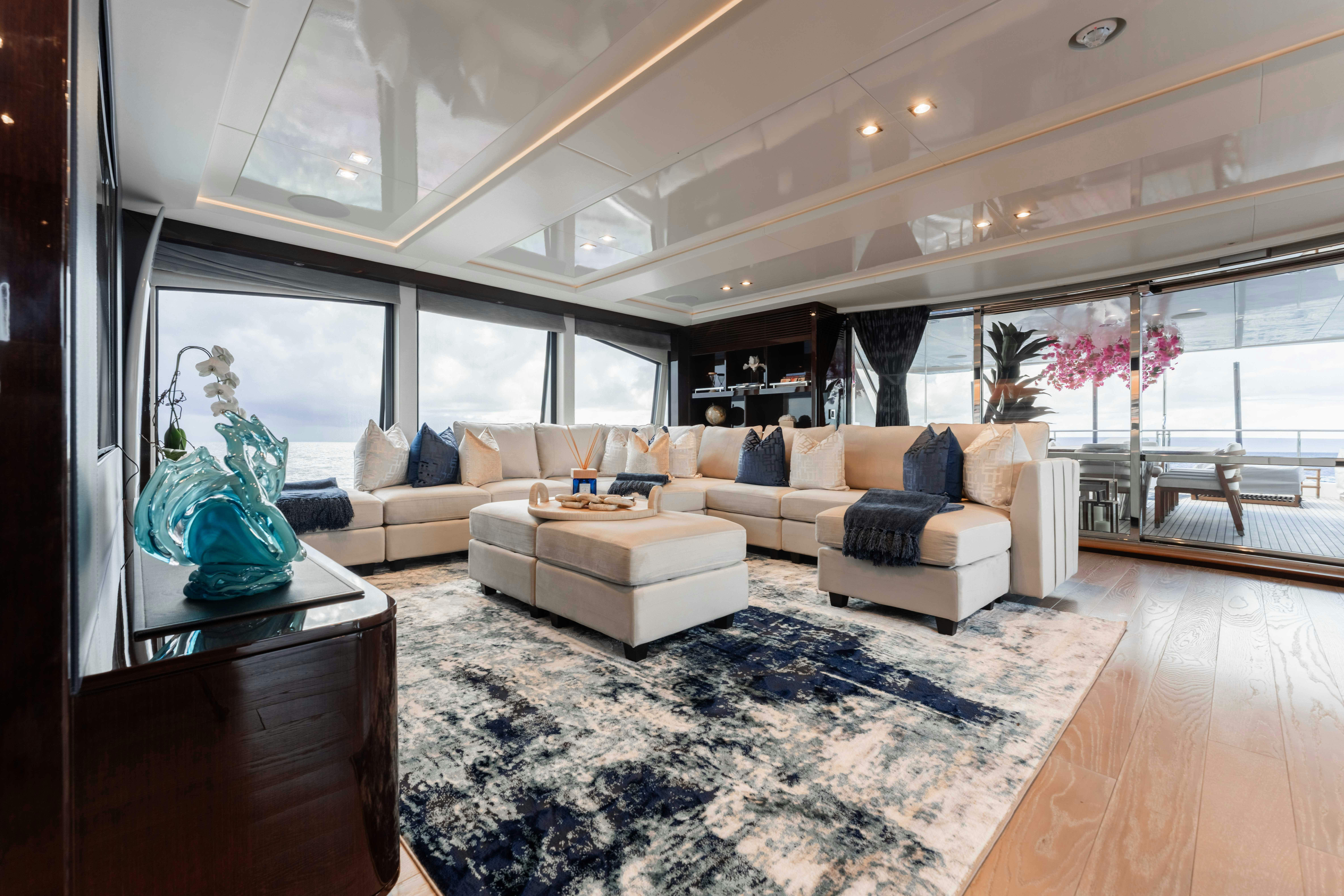 a living room with a large window aboard CAPTAIN MORGAN III Yacht for Charter