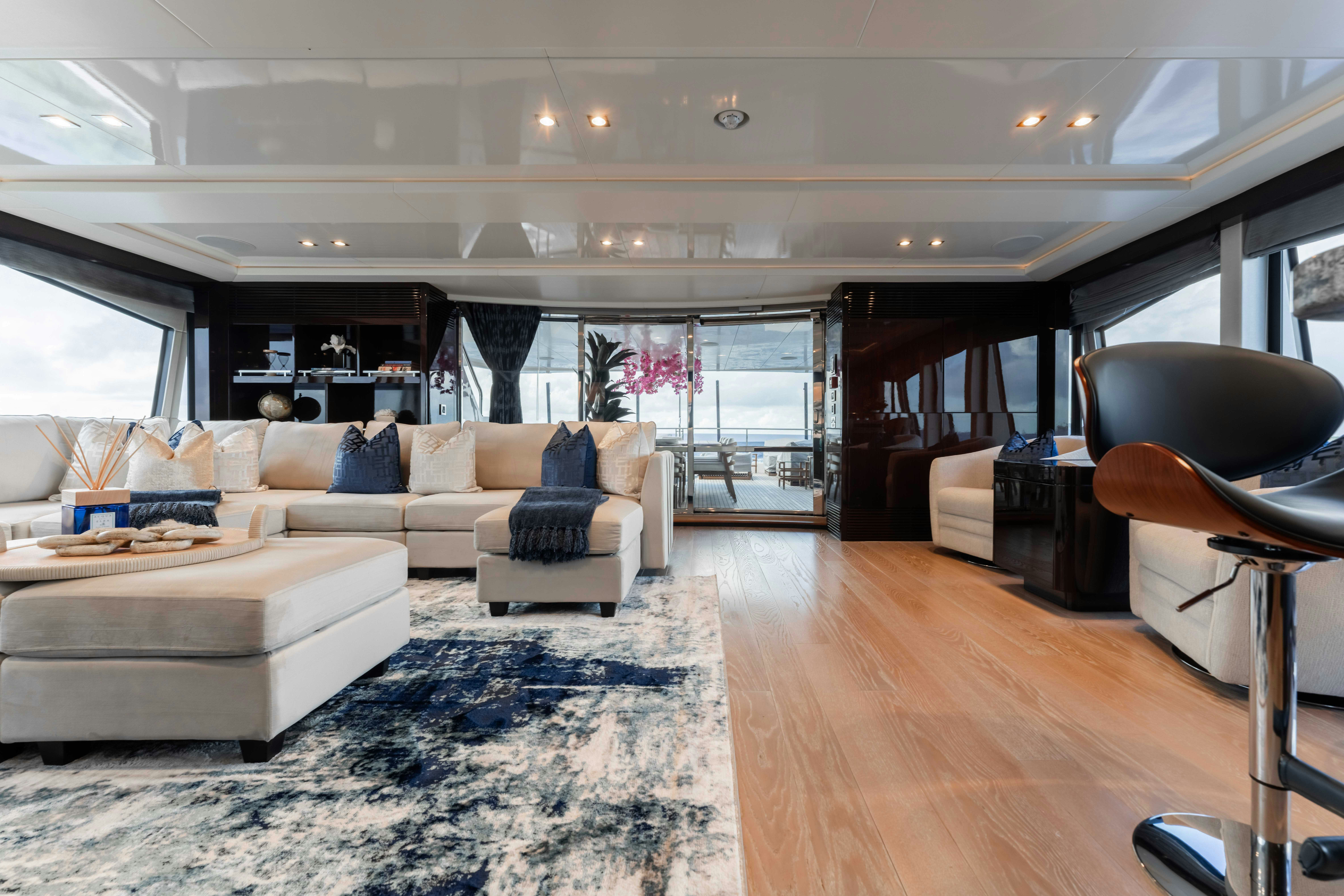 a living room with a large window aboard CAPTAIN MORGAN III Yacht for Charter