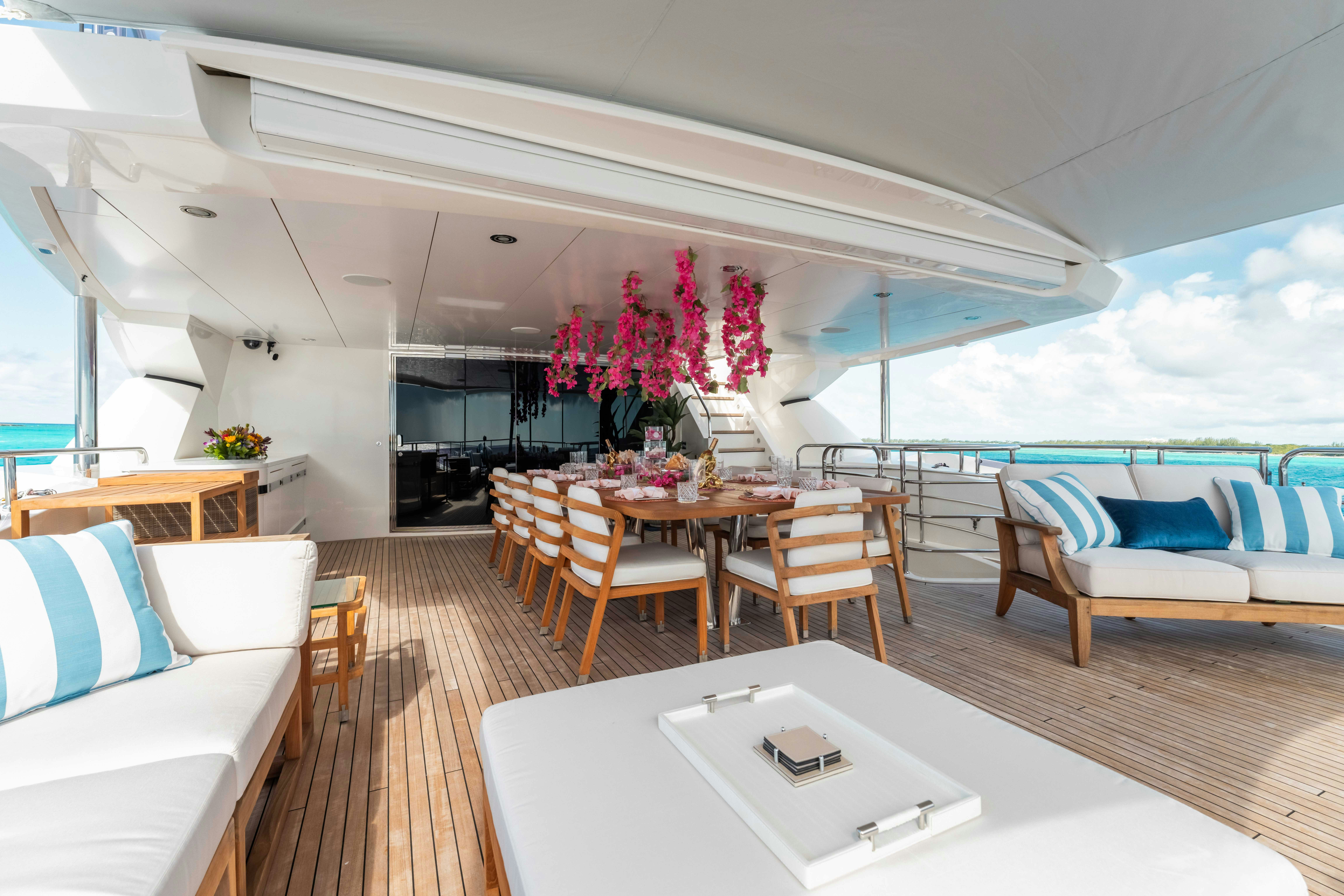 a room with a table and chairs aboard CAPTAIN MORGAN III Yacht for Charter
