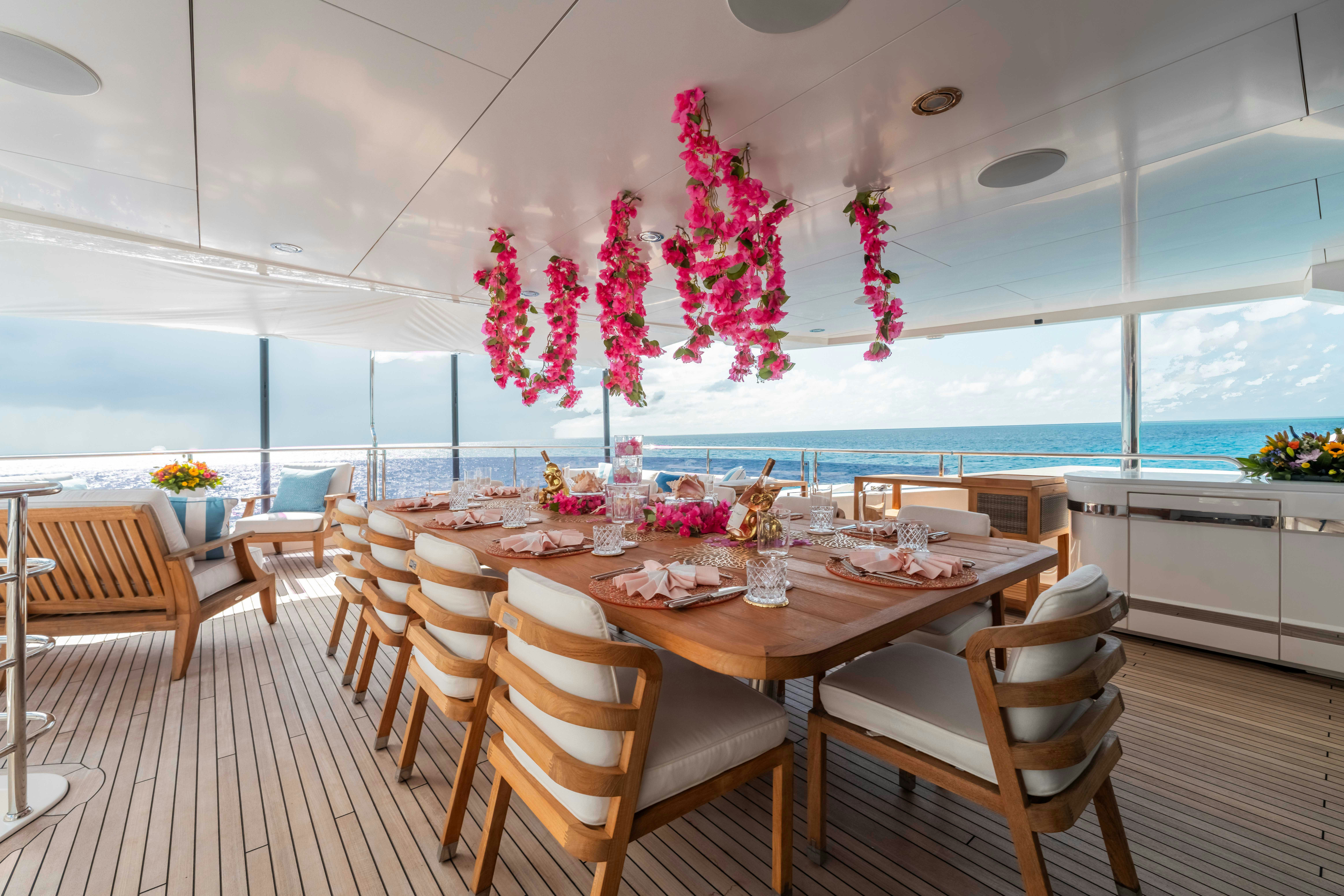 a dining room with a table set for a meal aboard CAPTAIN MORGAN III Yacht for Charter