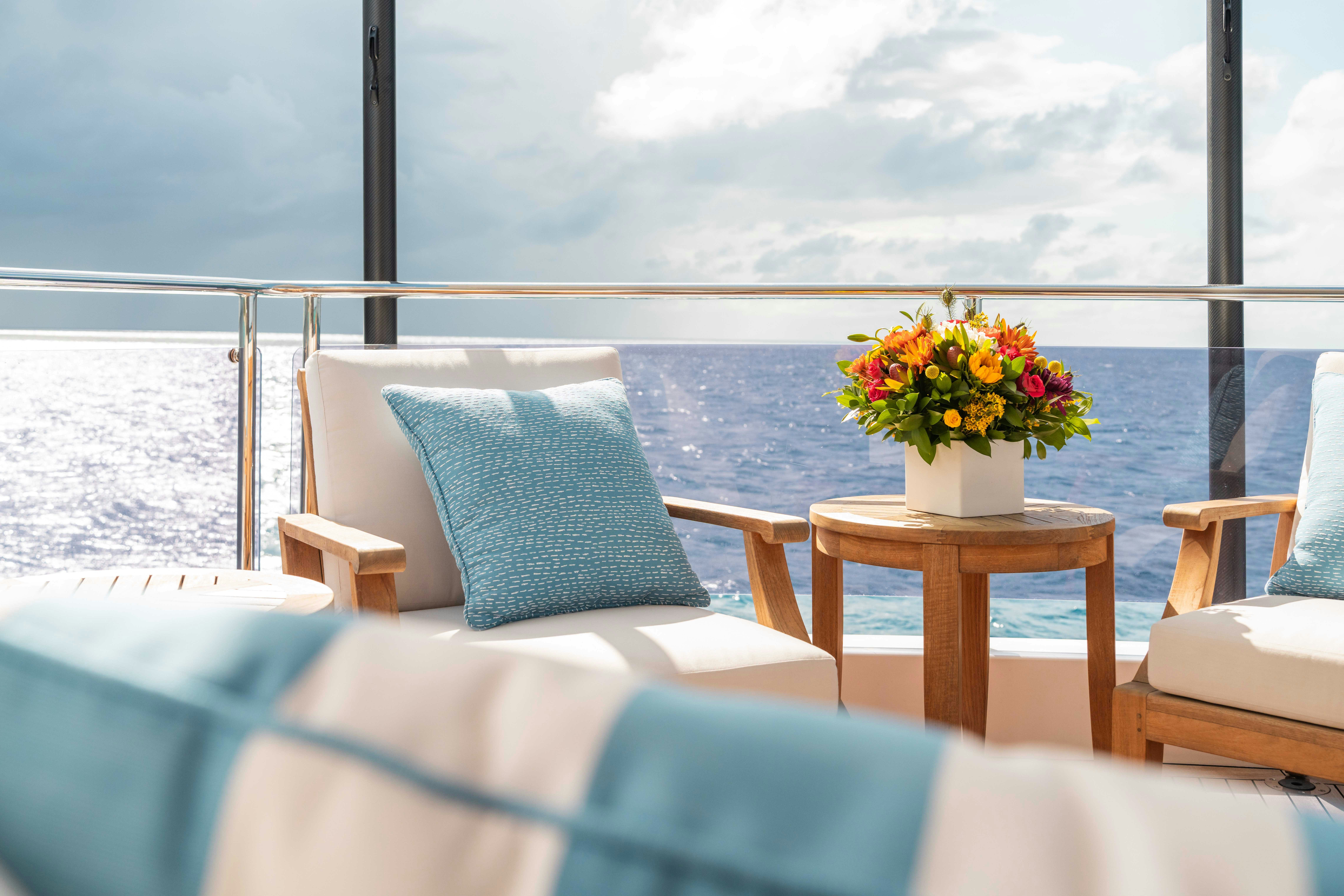 a room with a table and chairs aboard CAPTAIN MORGAN III Yacht for Charter
