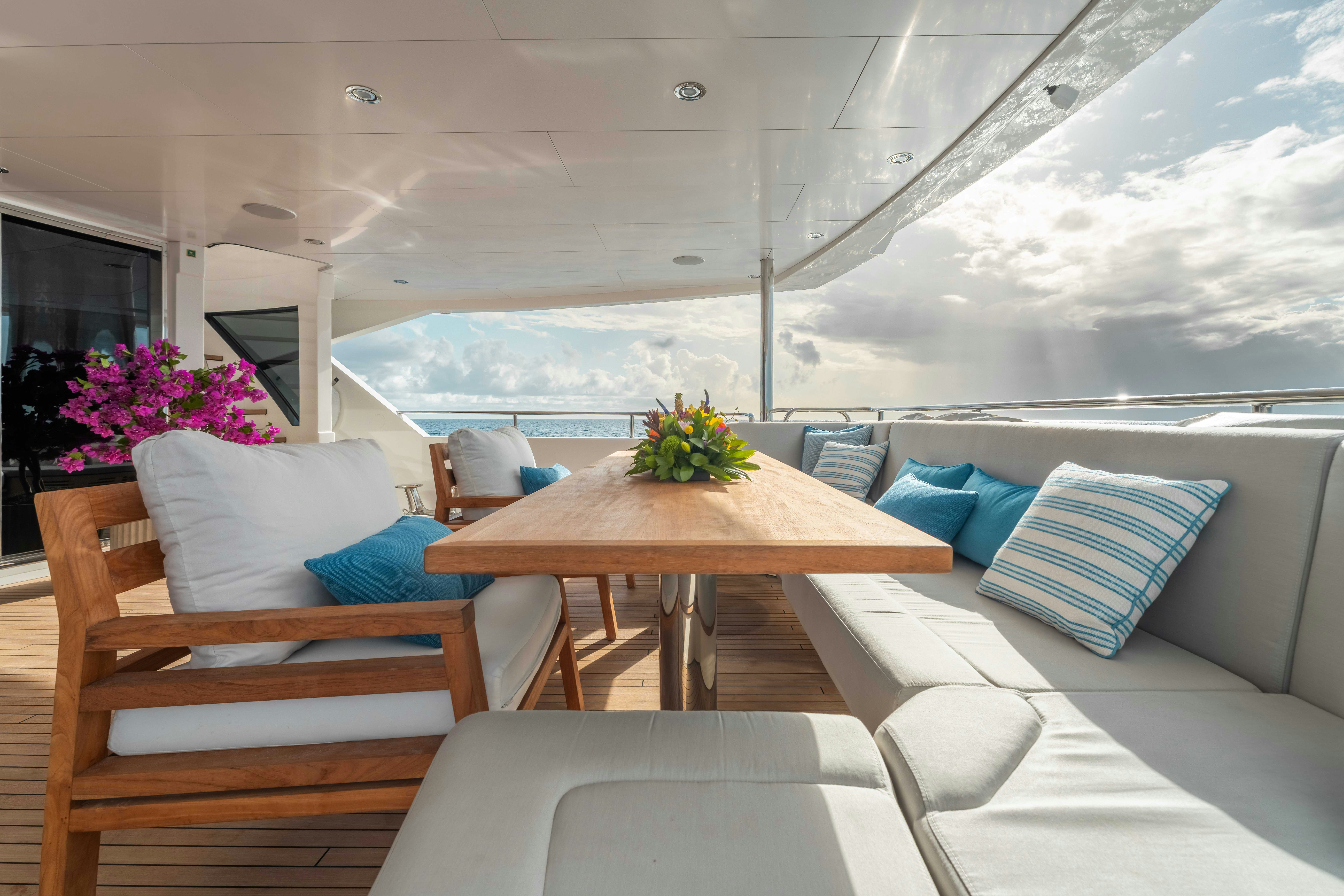 a room with a table and chairs aboard CAPTAIN MORGAN III Yacht for Charter