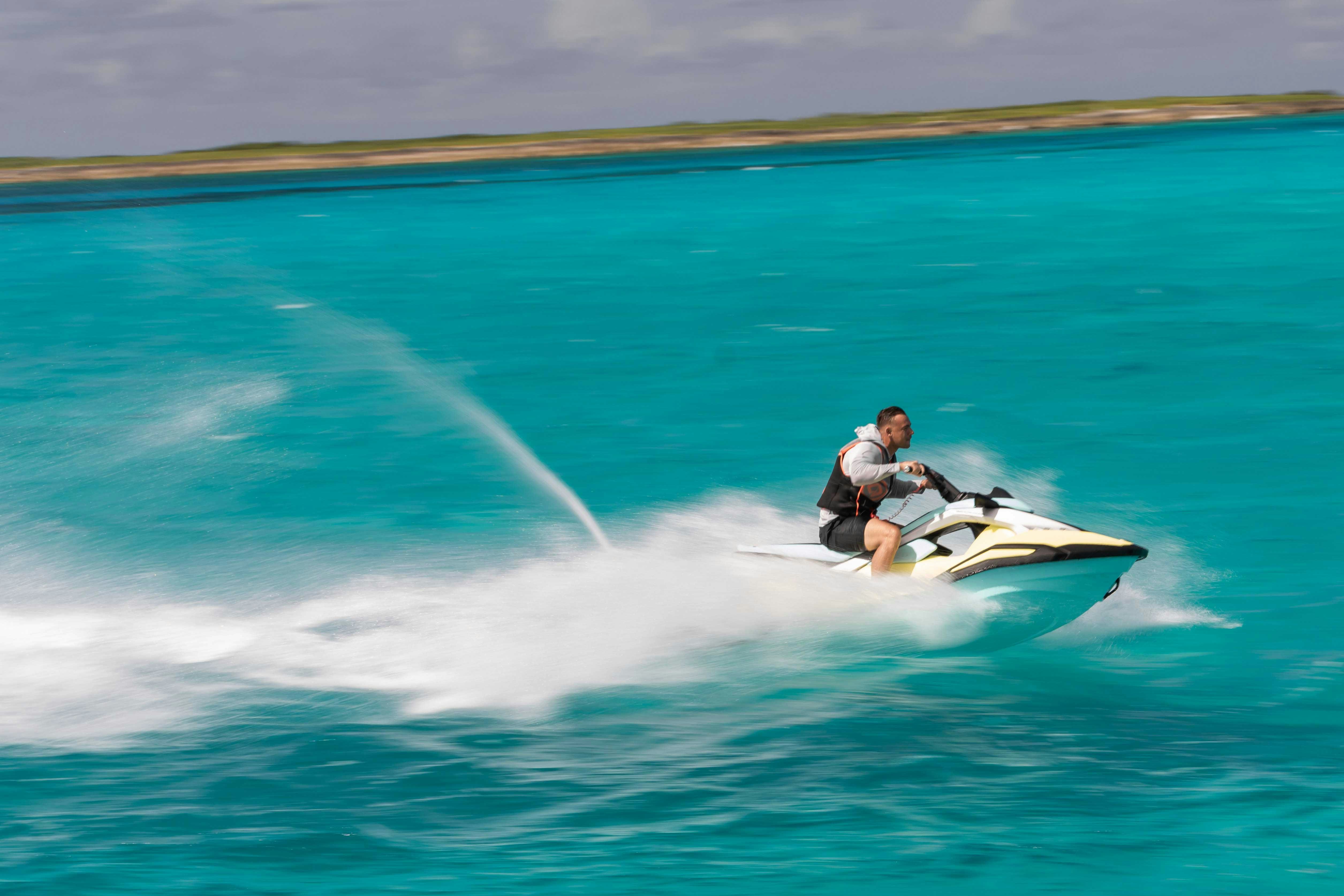 a man on a jet ski aboard CAPTAIN MORGAN III Yacht for Charter