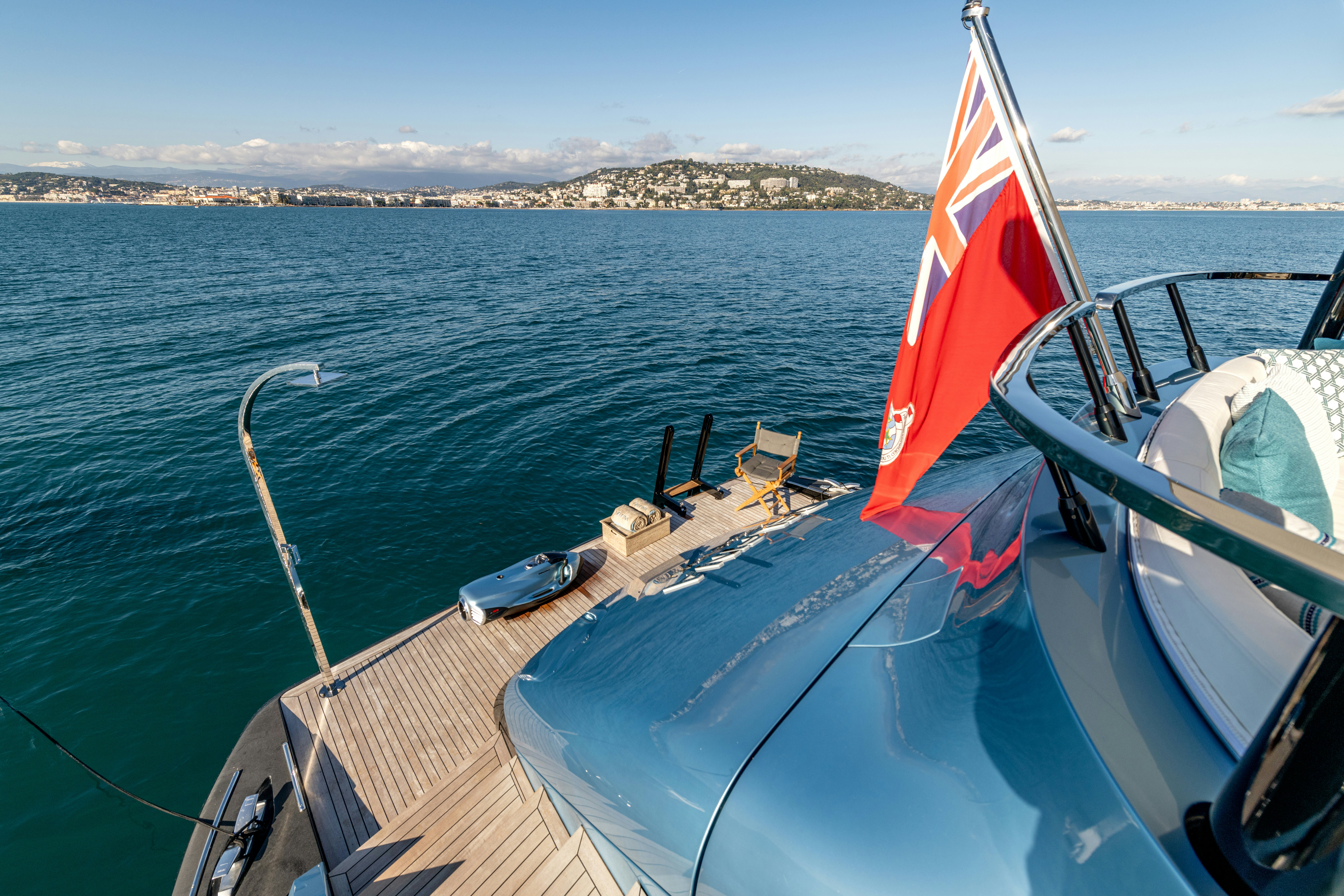 a boat with a flag on the front aboard DELFINA Yacht for Sale