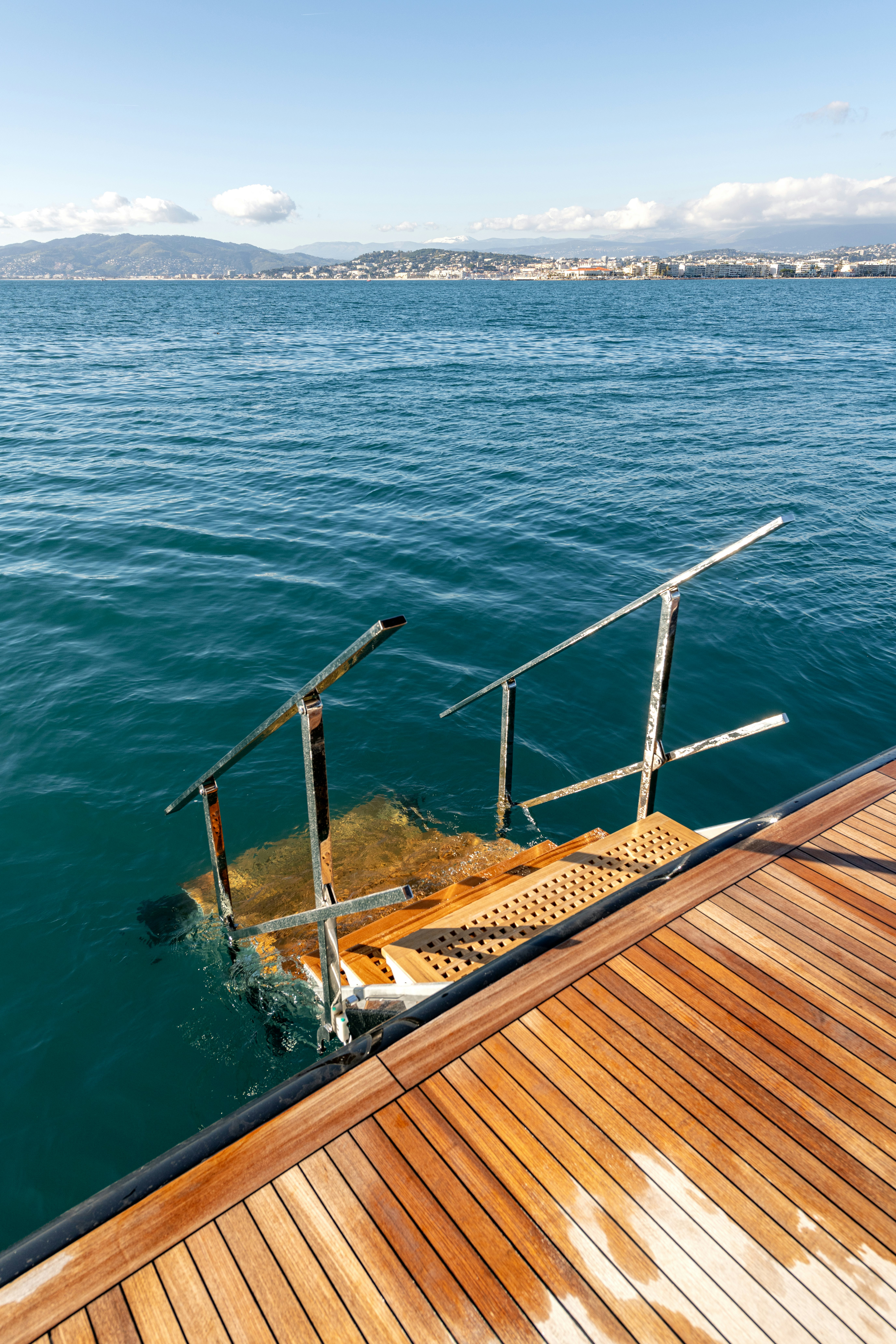 a wooden dock over the water aboard DELFINA Yacht for Sale