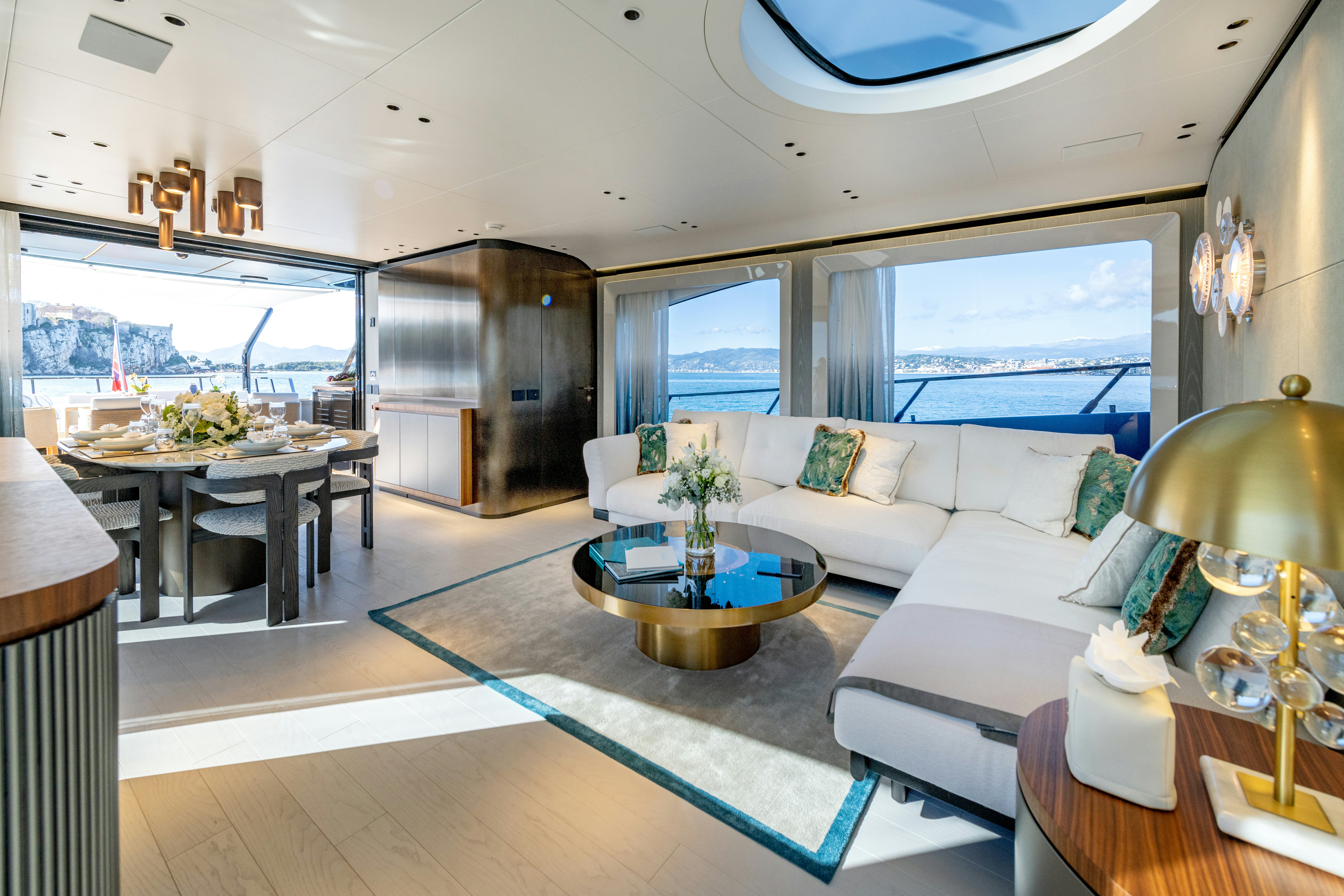 a living room with a large window aboard DELFINA Yacht for Sale
