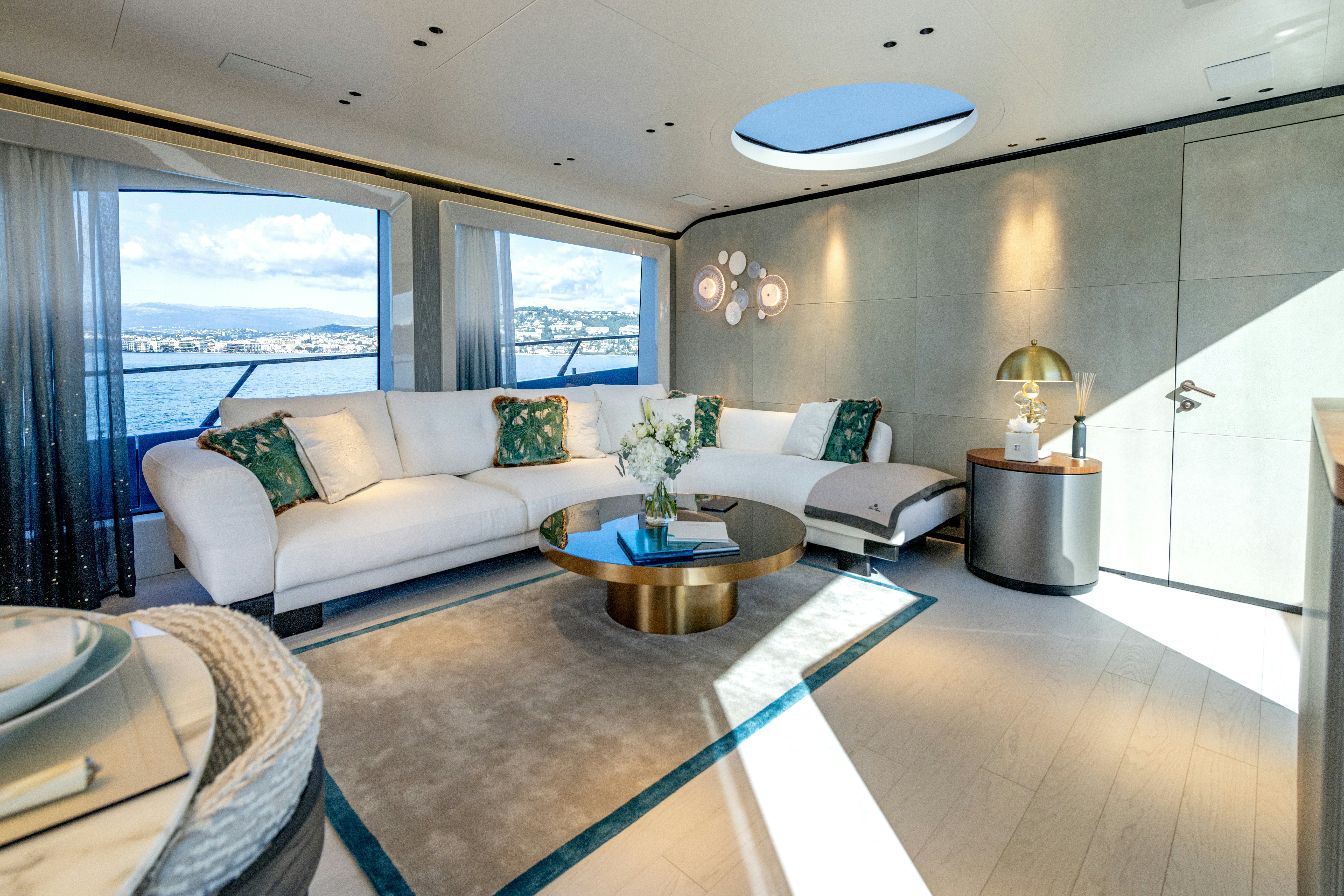 a living room with a large window aboard DELFINA Yacht for Sale