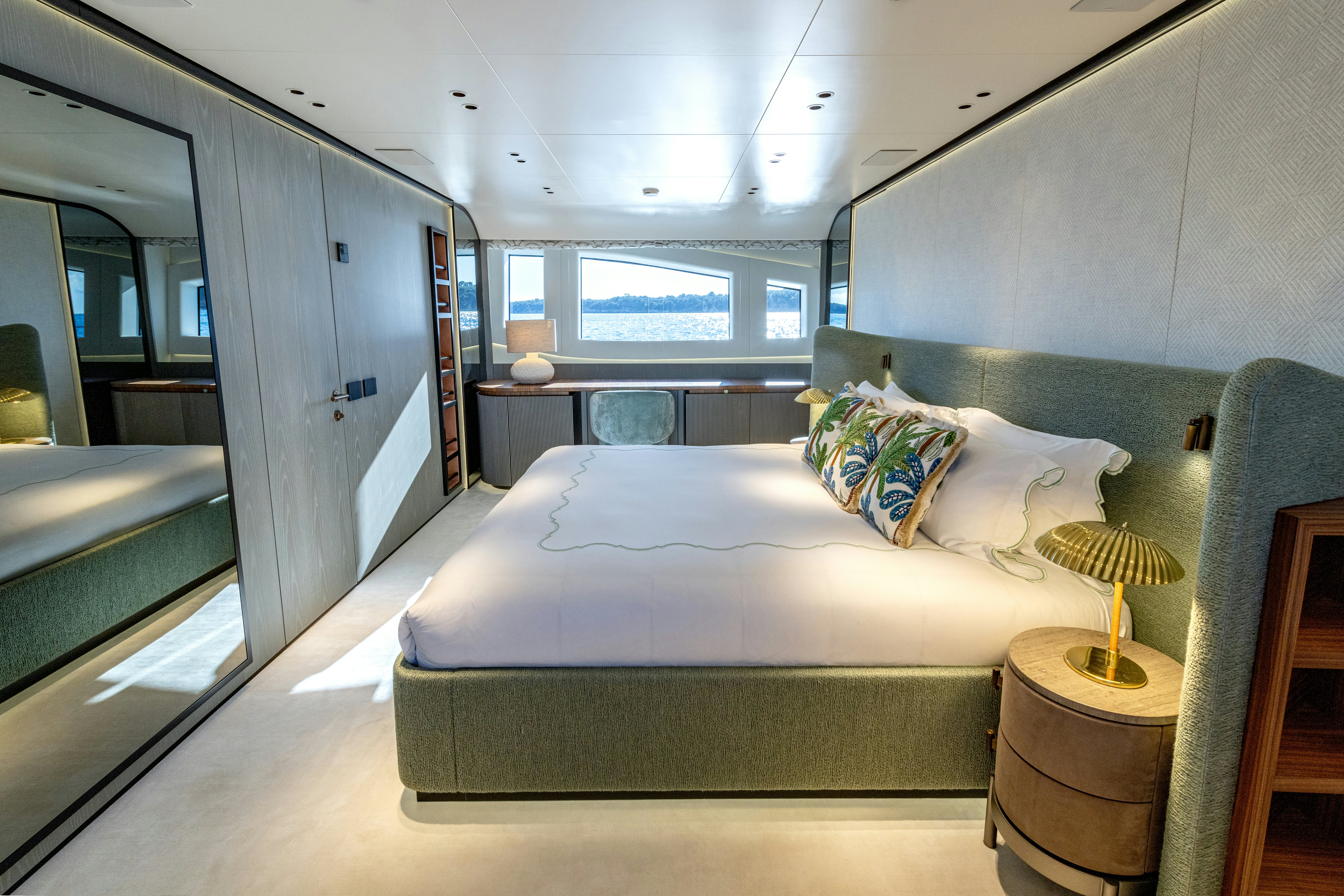 a bed in a room aboard DELFINA Yacht for Sale