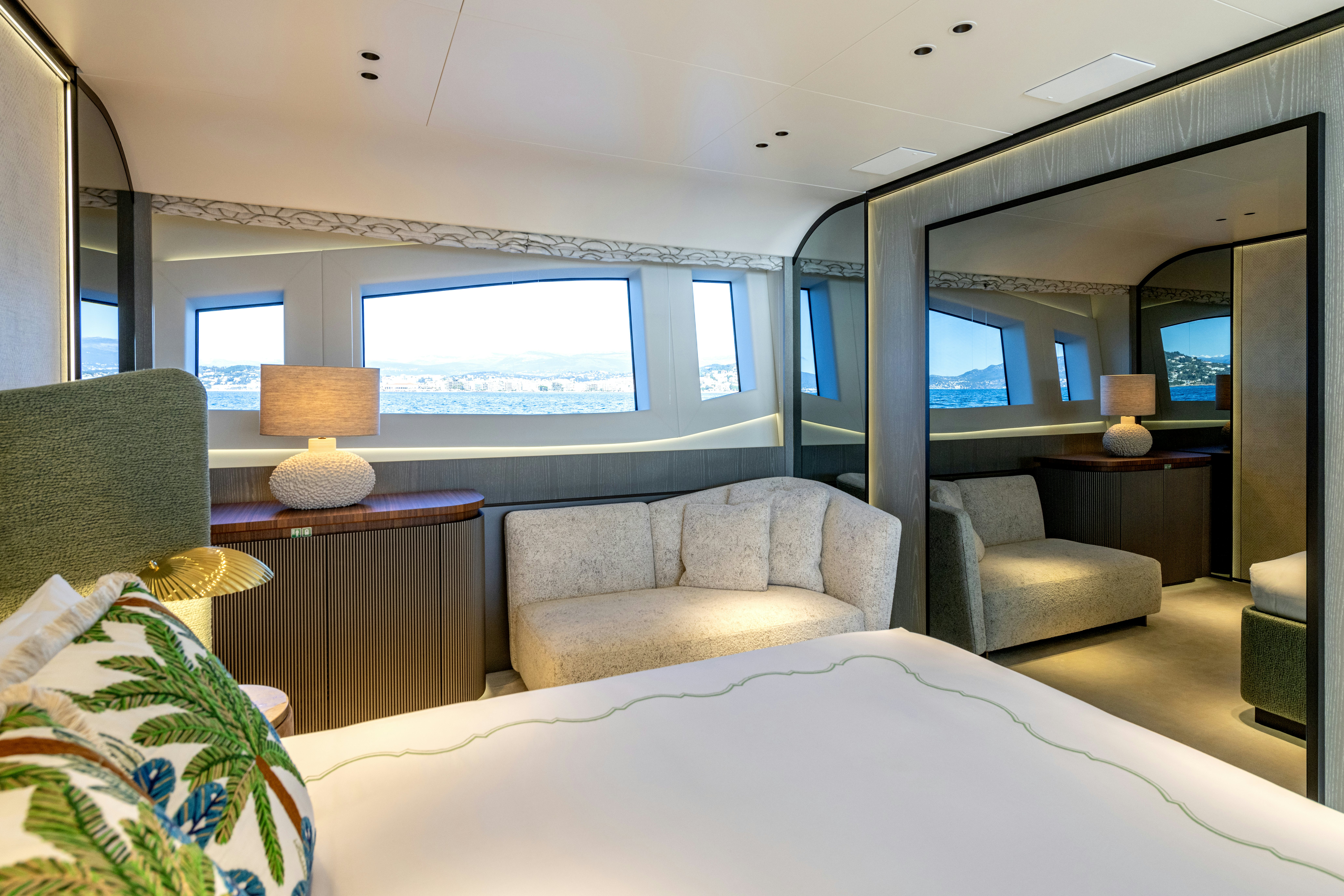 a bedroom with a bed and a desk aboard DELFINA Yacht for Sale