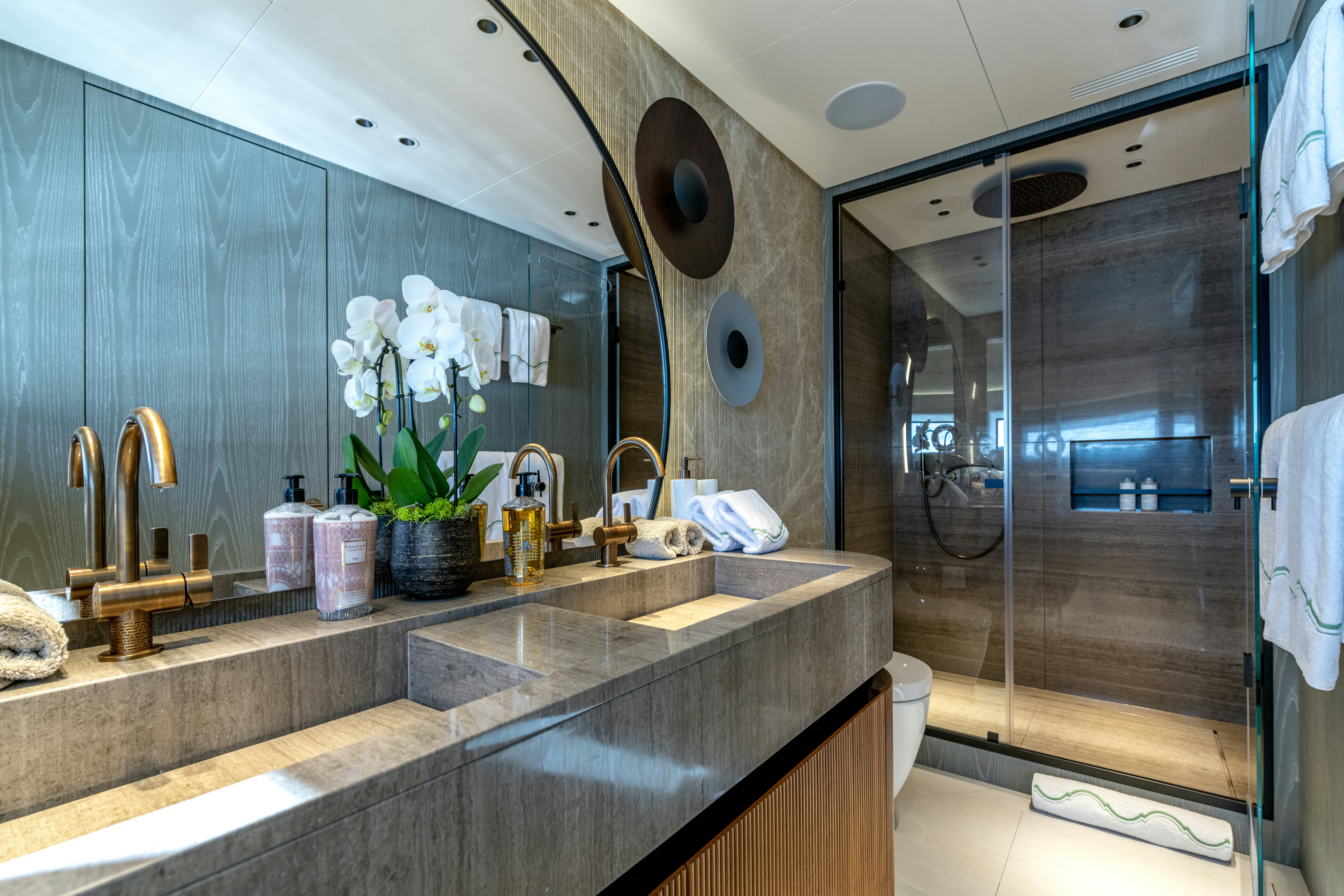 a bathroom with a large mirror aboard DELFINA Yacht for Sale