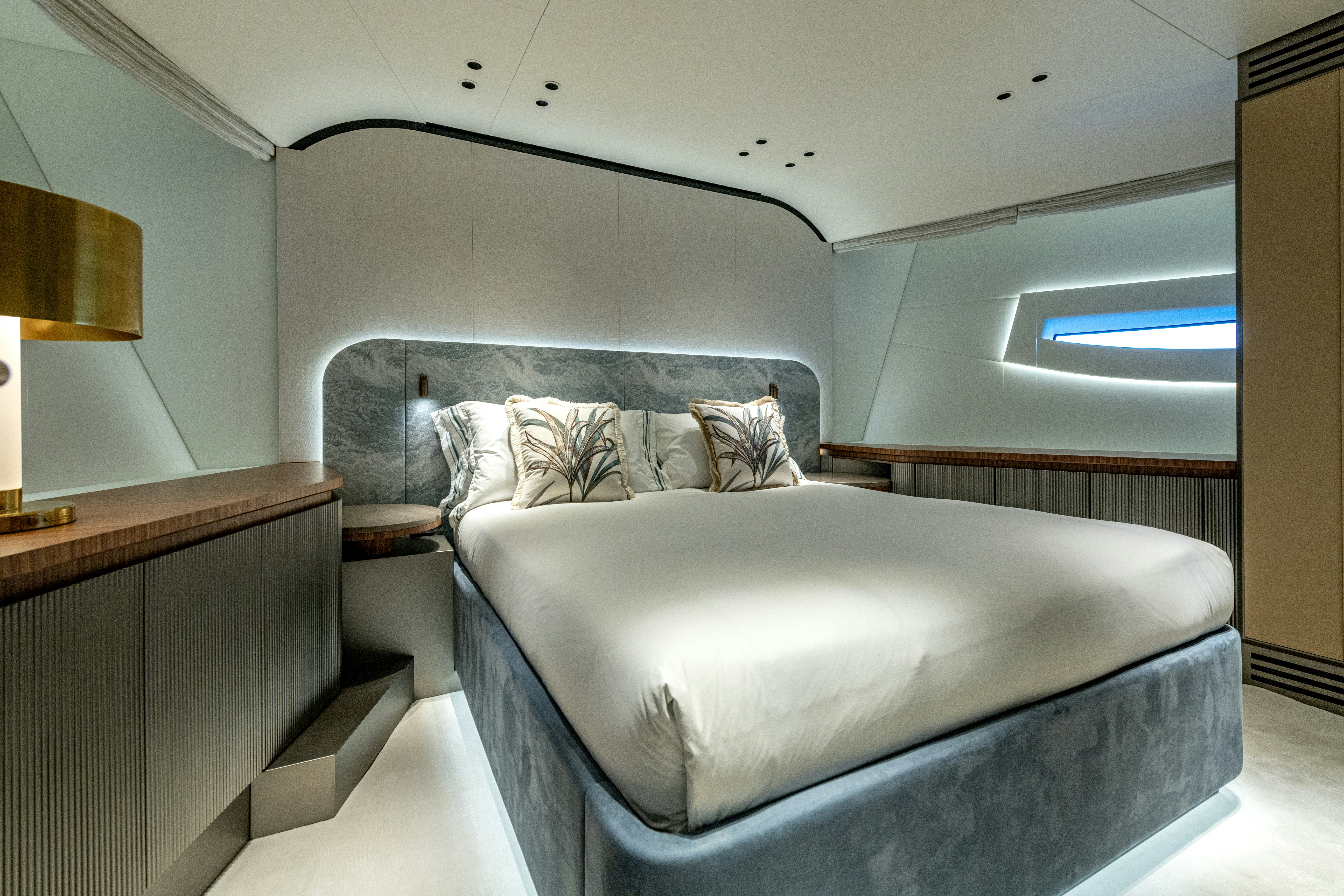 a bed in a room aboard DELFINA Yacht for Sale