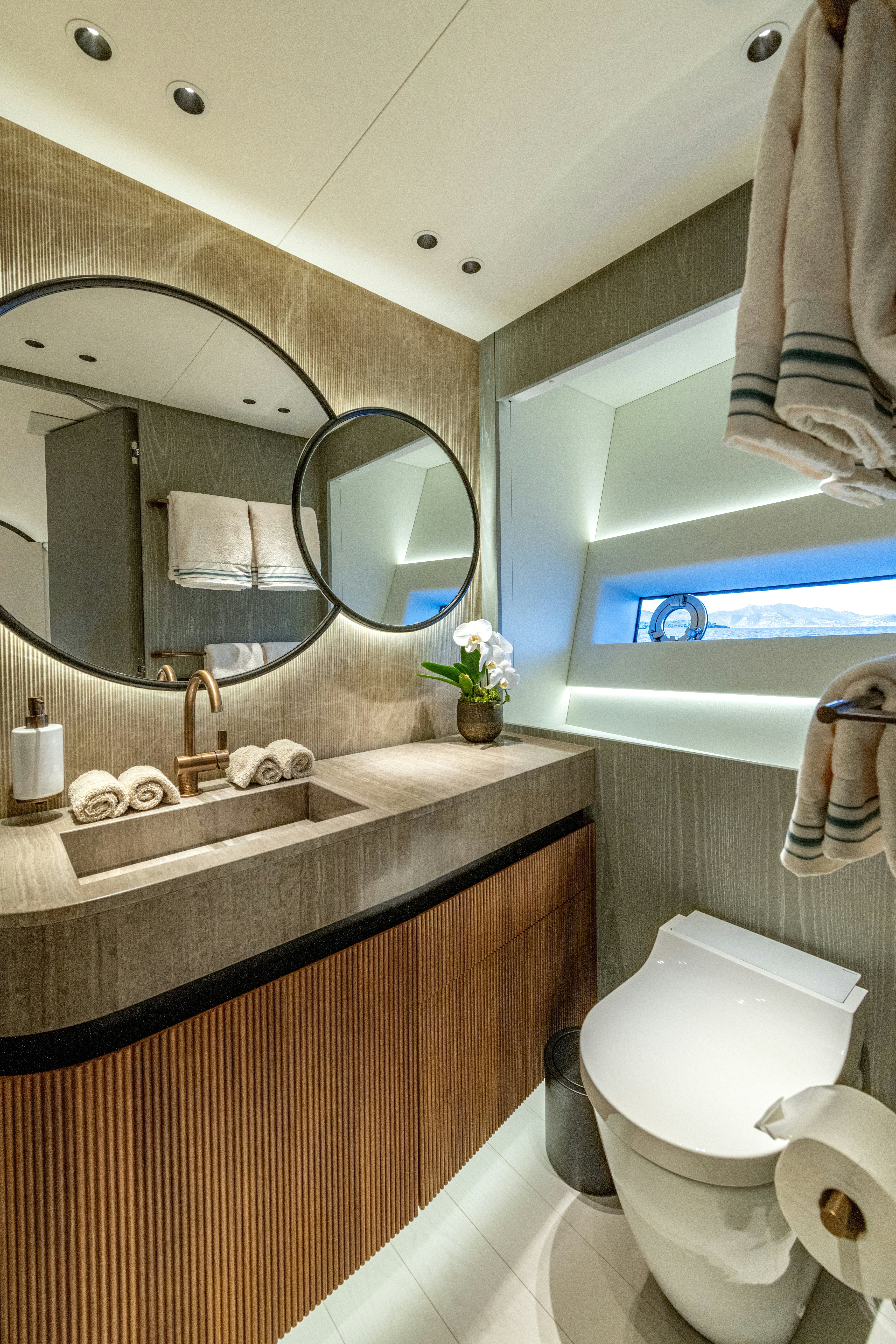a bathroom with a large mirror aboard DELFINA Yacht for Sale
