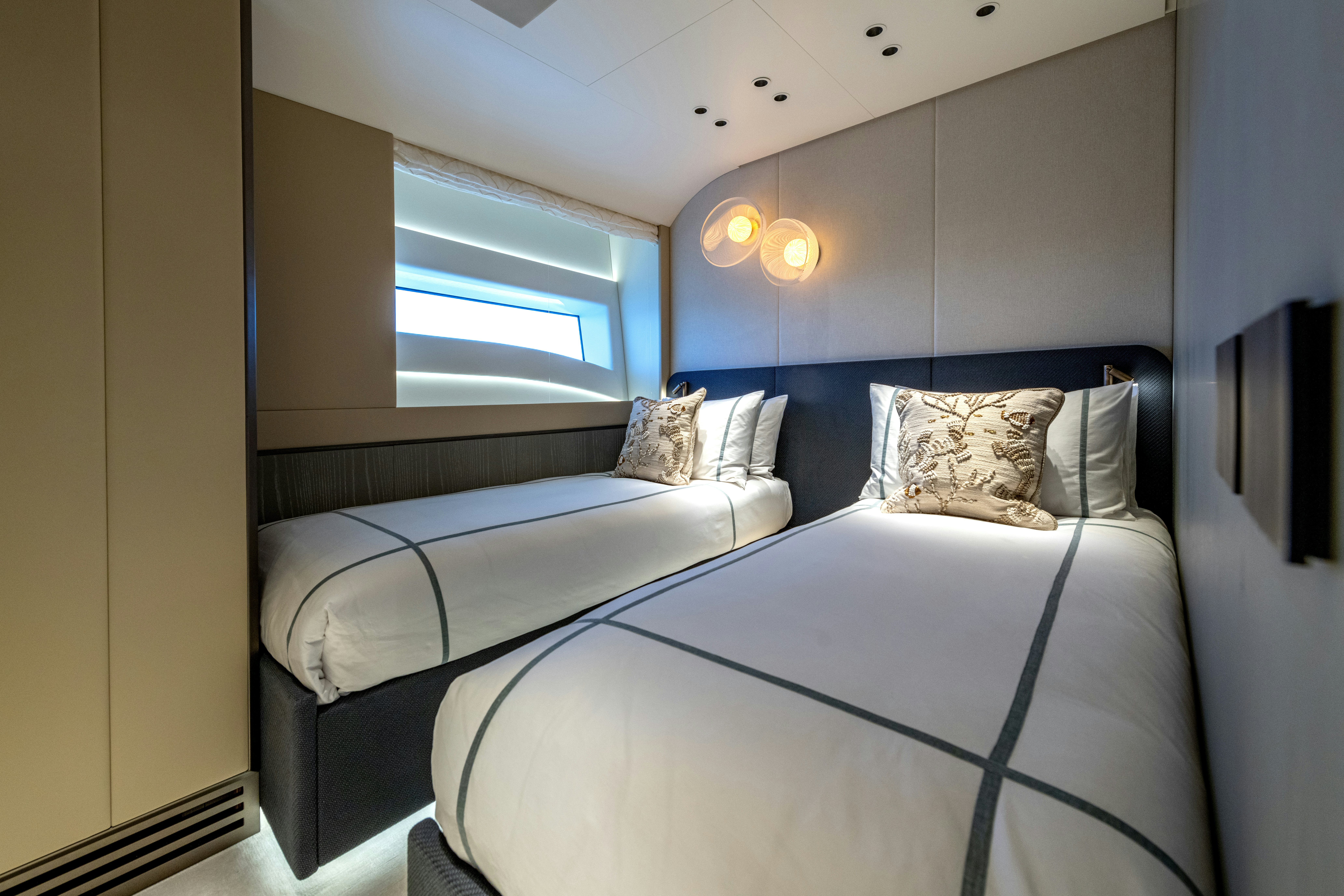 a couple of beds in a room aboard DELFINA Yacht for Sale
