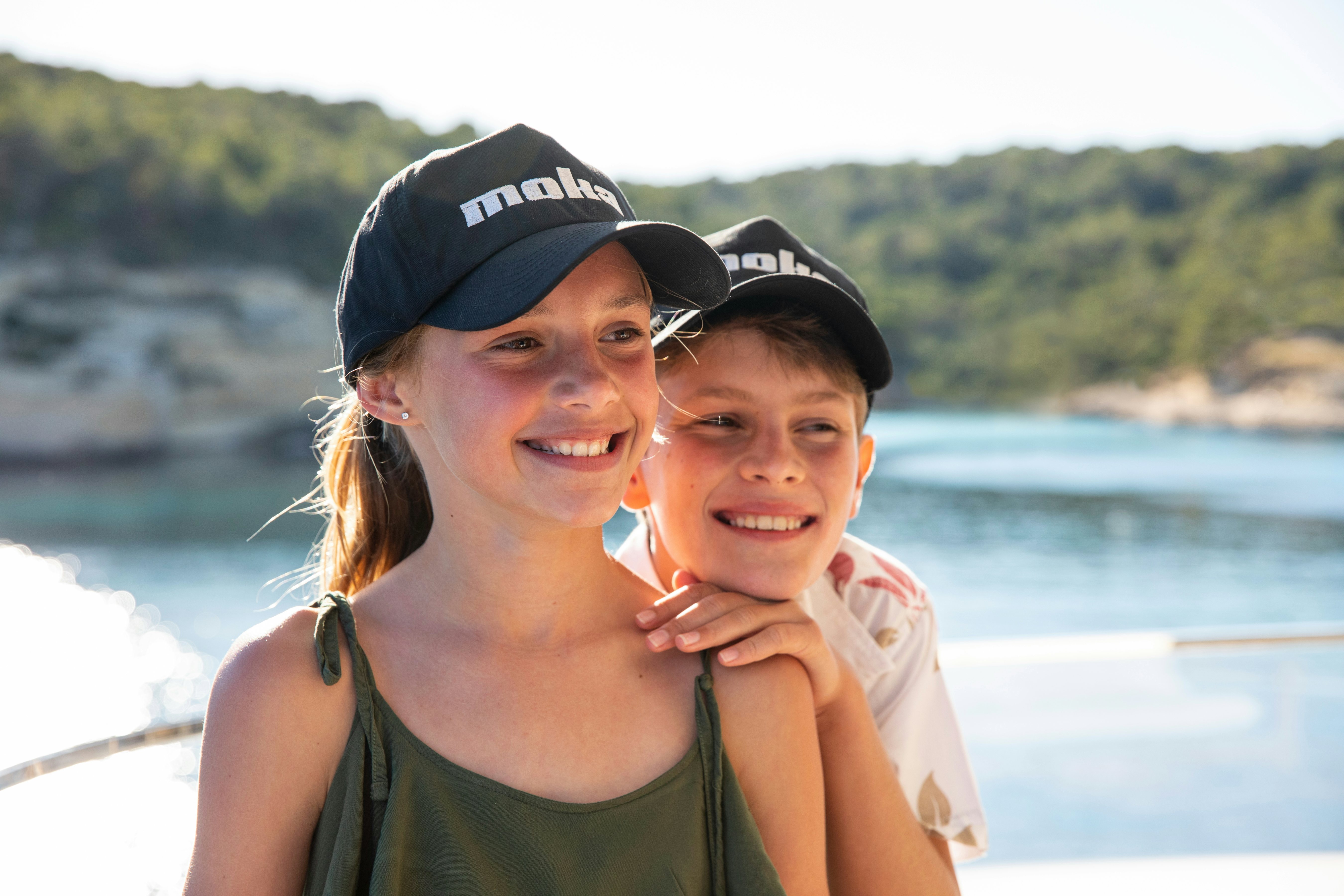 a woman and a child posing for a photo aboard MOKA Yacht for Charter