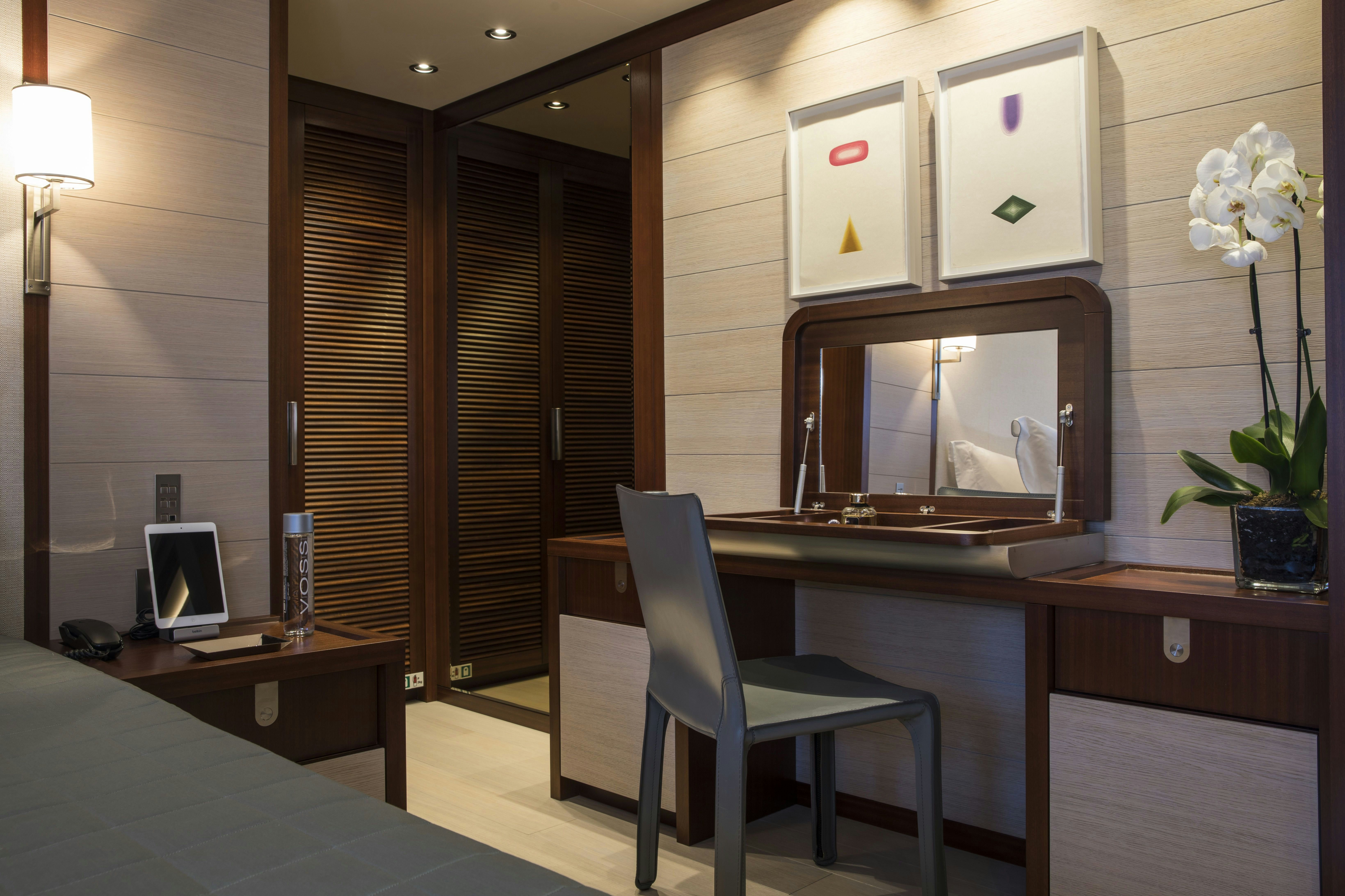 a room with a desk and a chair aboard MOKA Yacht for Charter