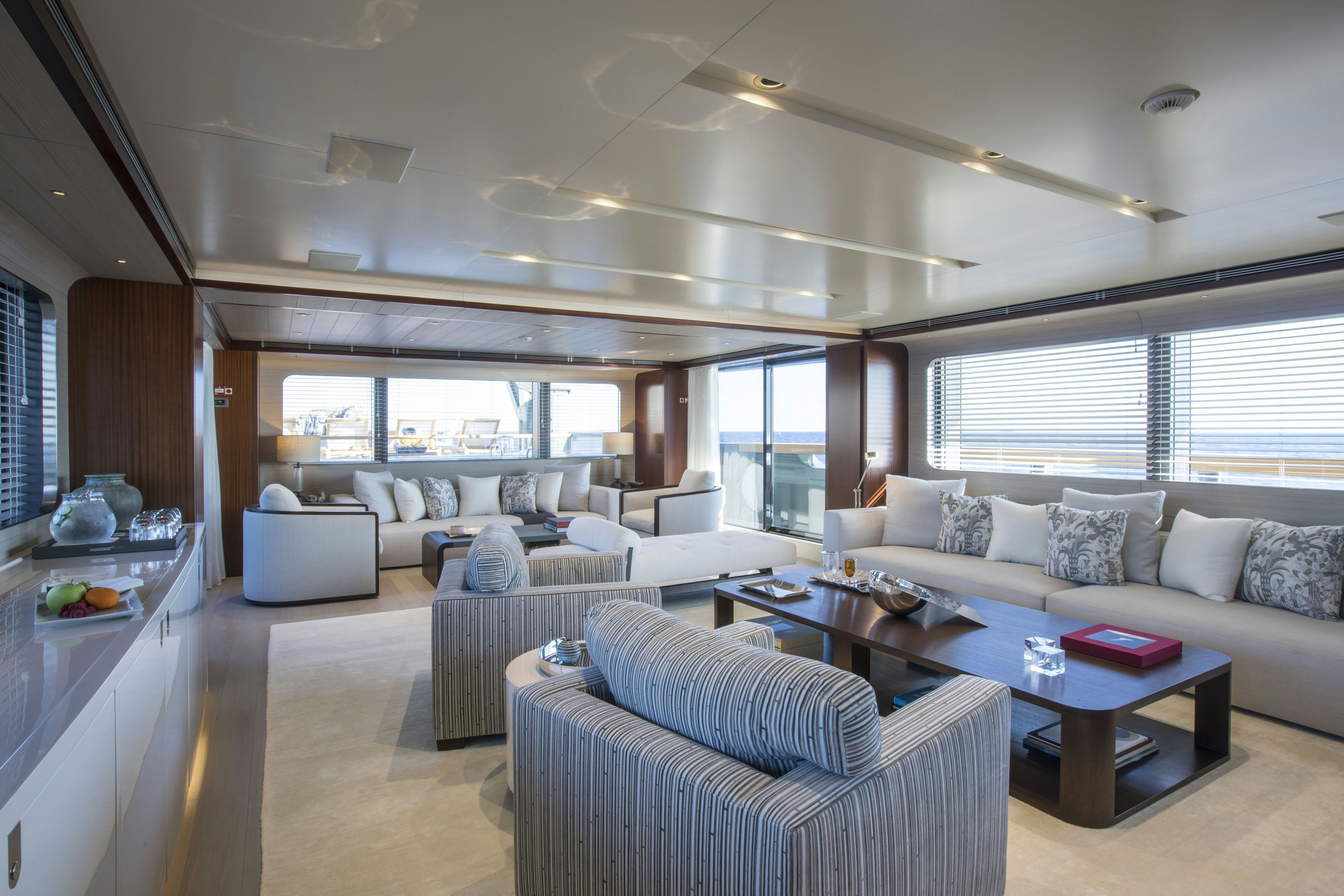 a living room with a large window aboard MOKA Yacht for Charter