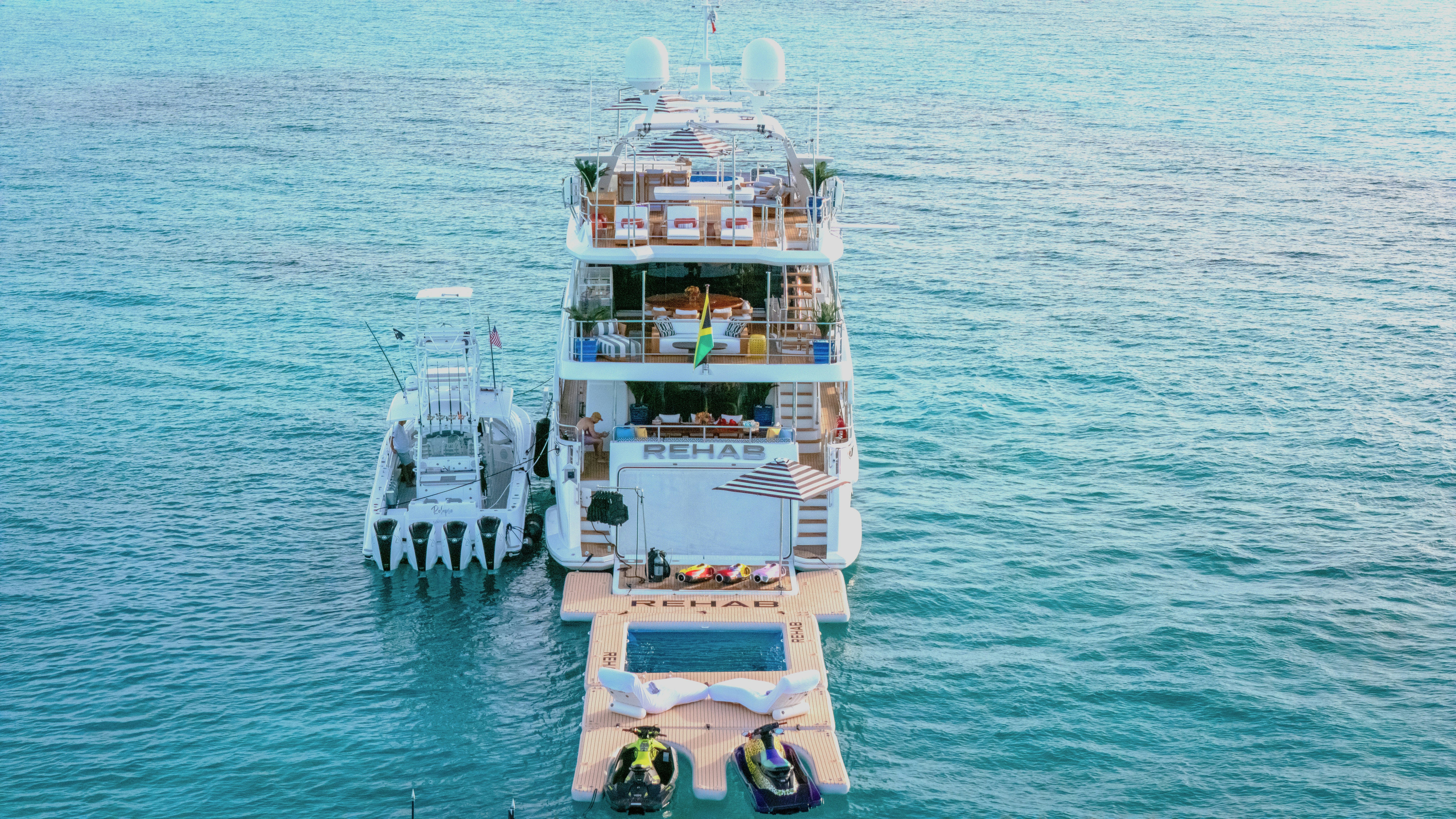 a large boat with people on it aboard REHAB Yacht for Sale