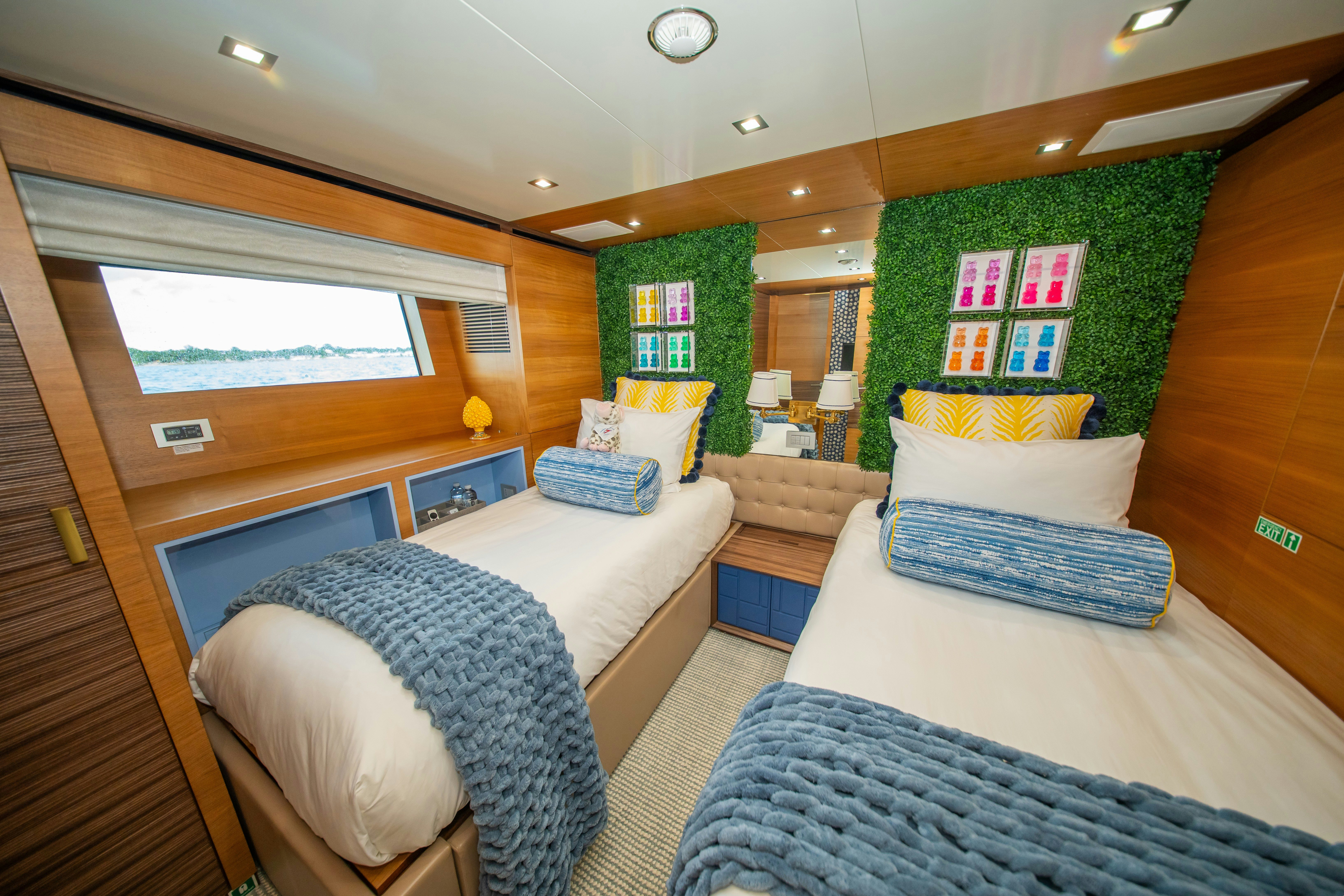 a room with a bed and a window aboard REHAB Yacht for Sale