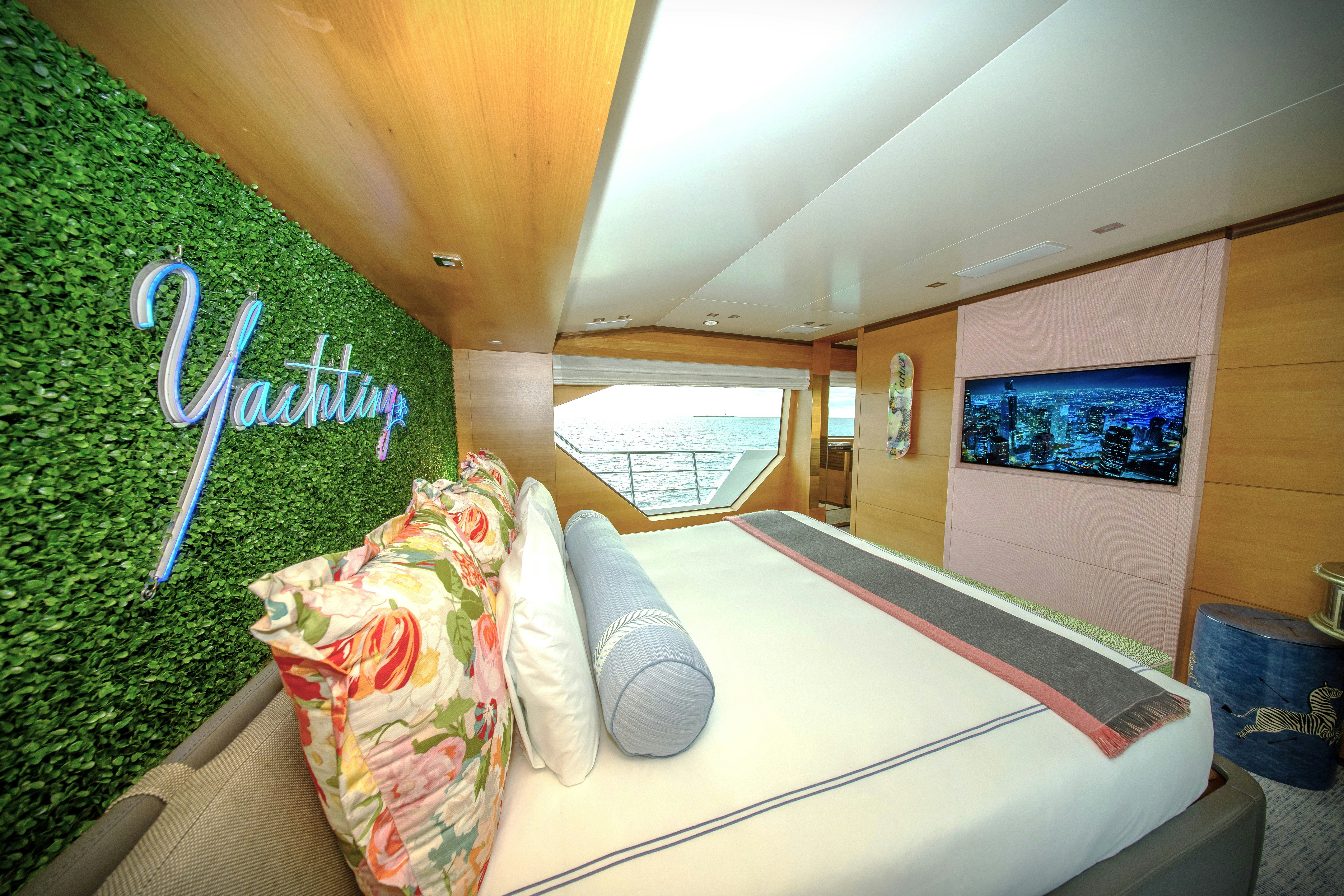 a room with a bed and a window aboard REHAB Yacht for Sale