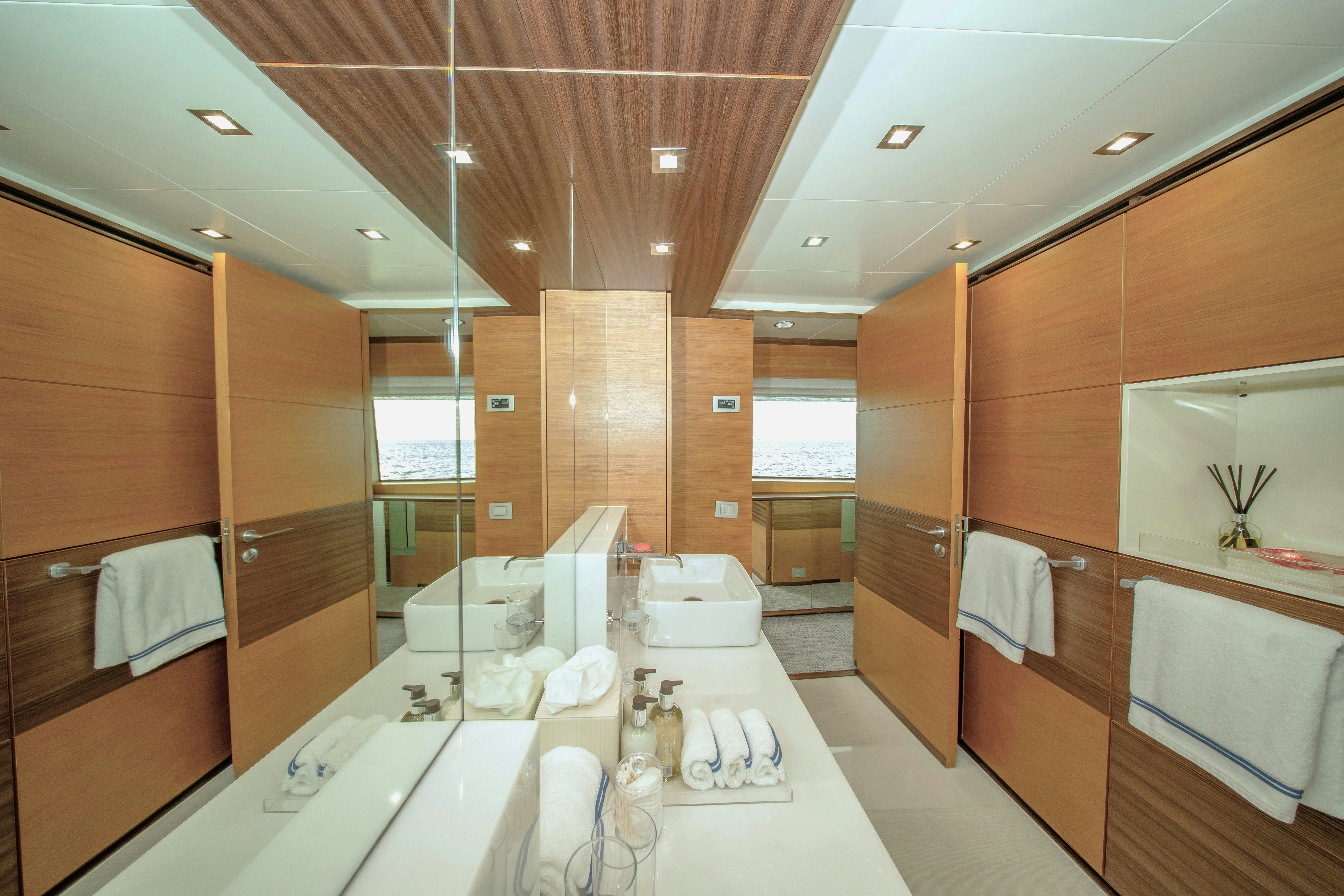 a bathroom with a large countertop aboard REHAB Yacht for Sale