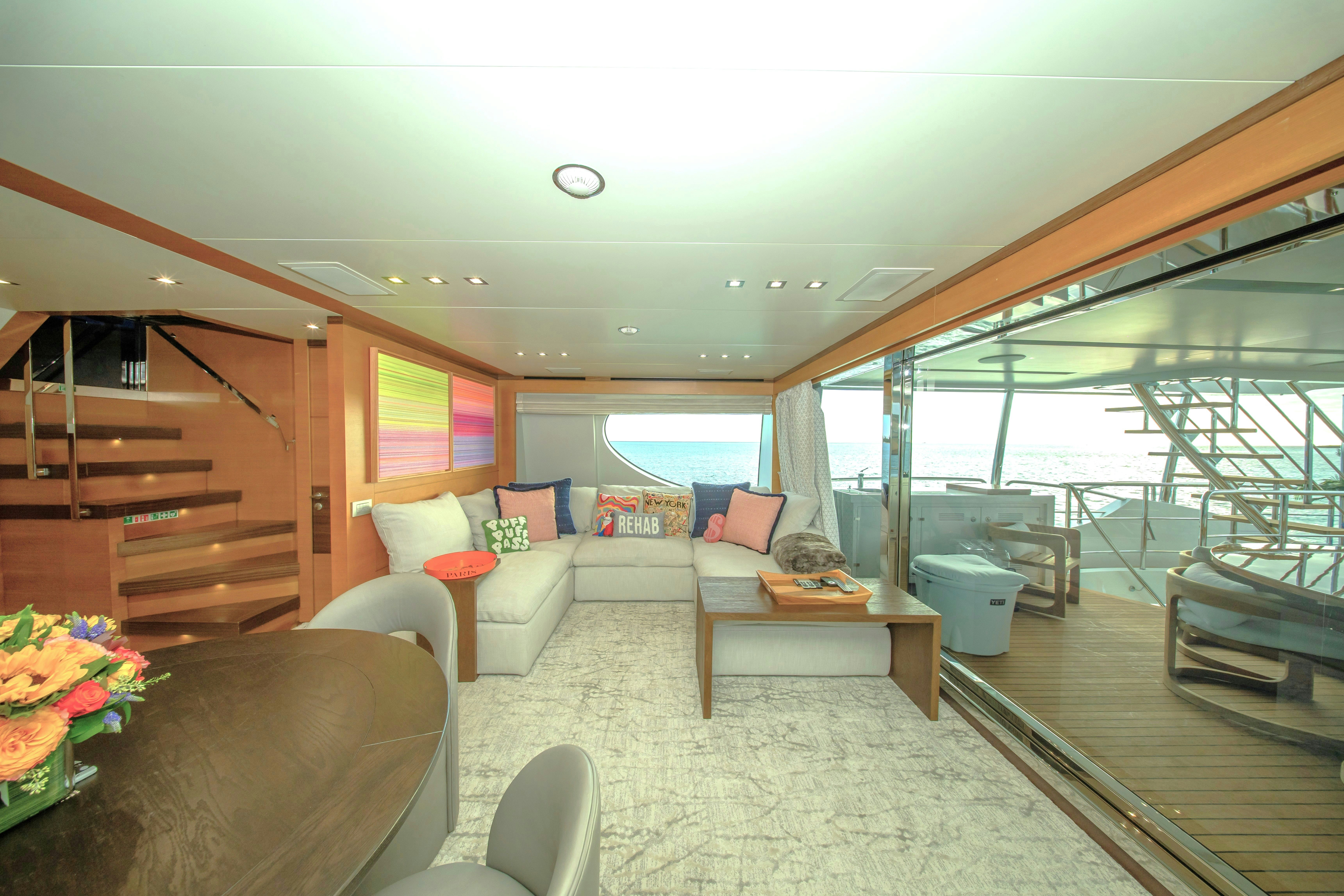 a living room with a large window aboard REHAB Yacht for Sale
