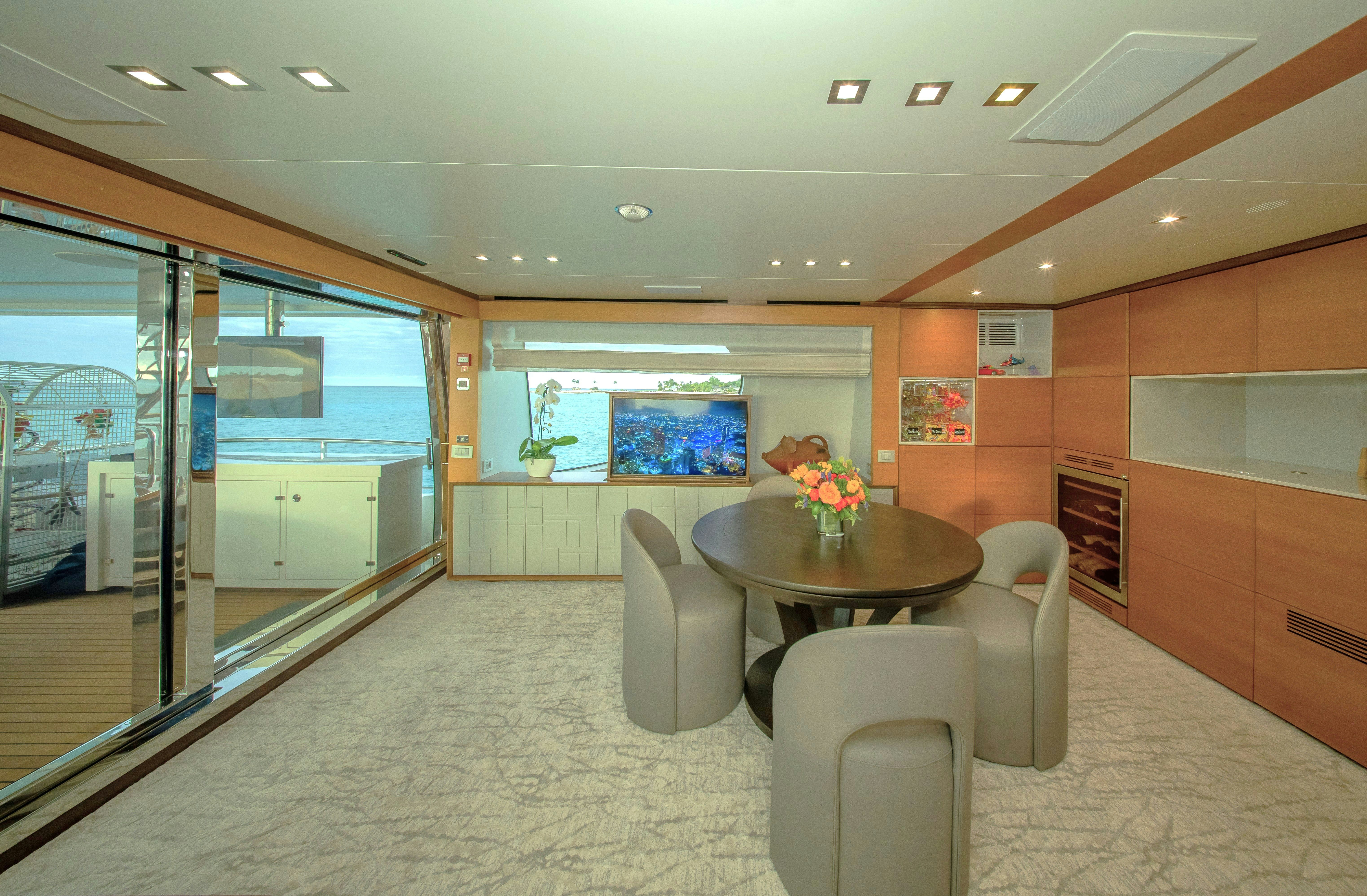 a room with a table and chairs aboard REHAB Yacht for Sale