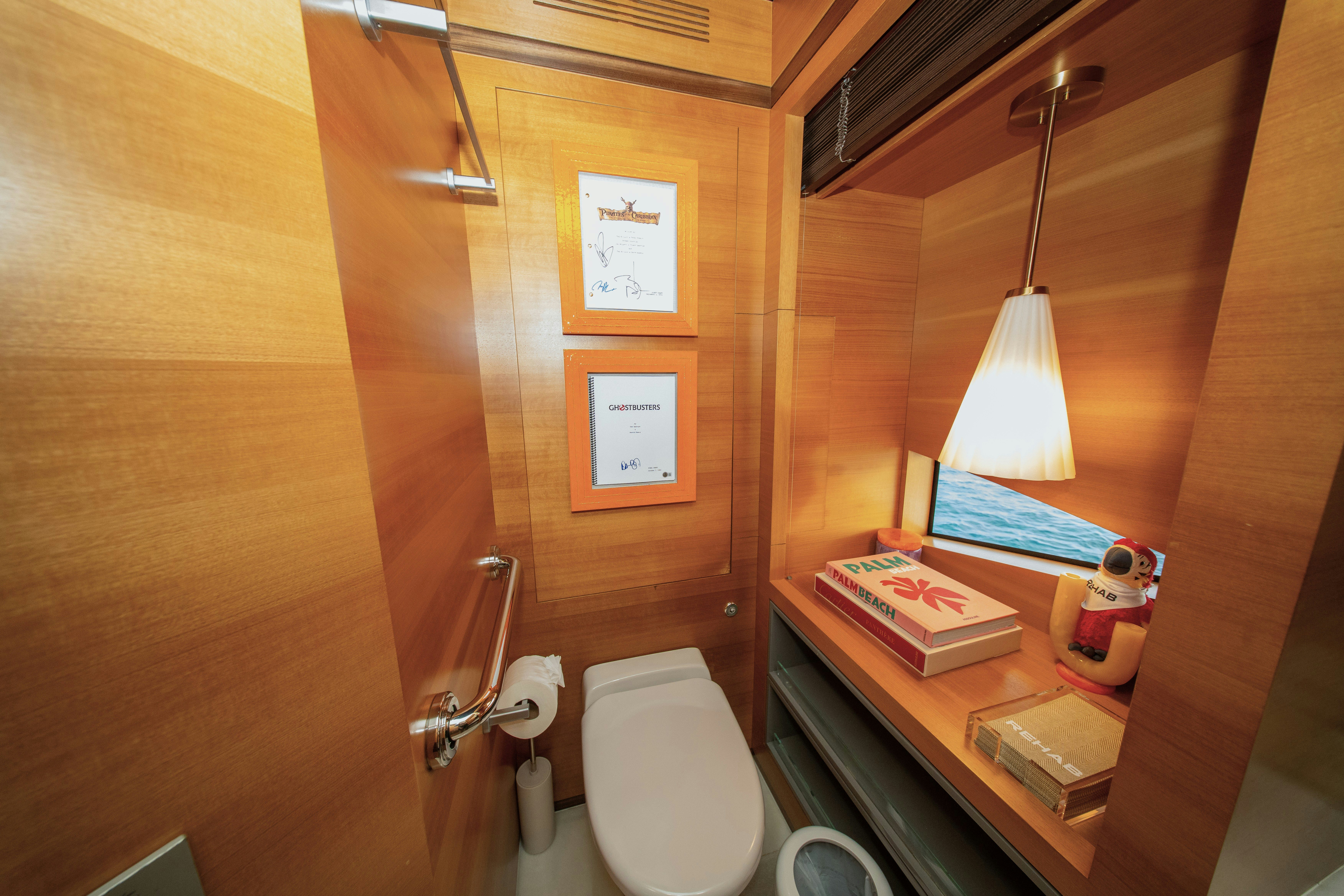 a bathroom with a toilet and a sink aboard REHAB Yacht for Sale