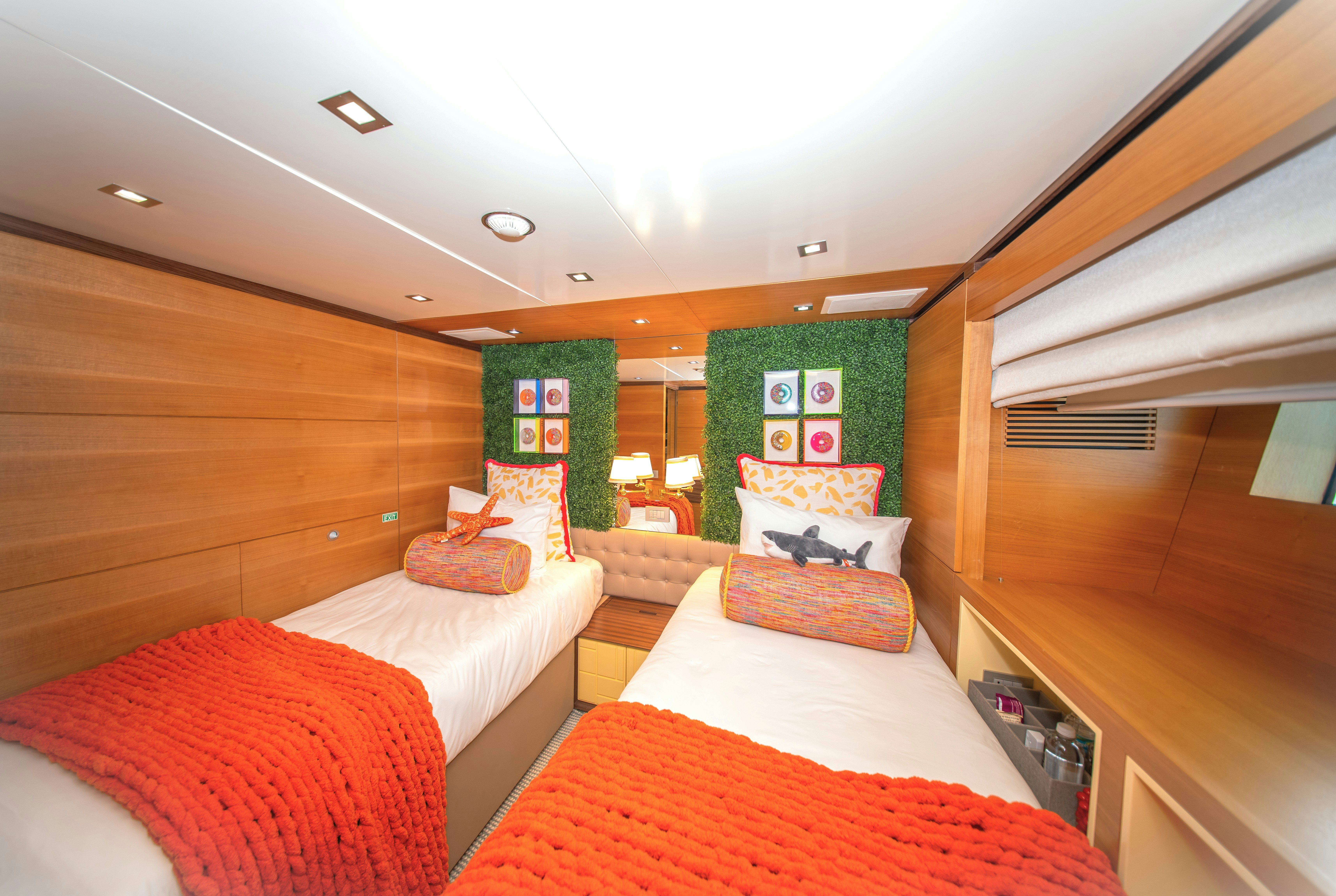 a room with a bed and a desk aboard REHAB Yacht for Sale