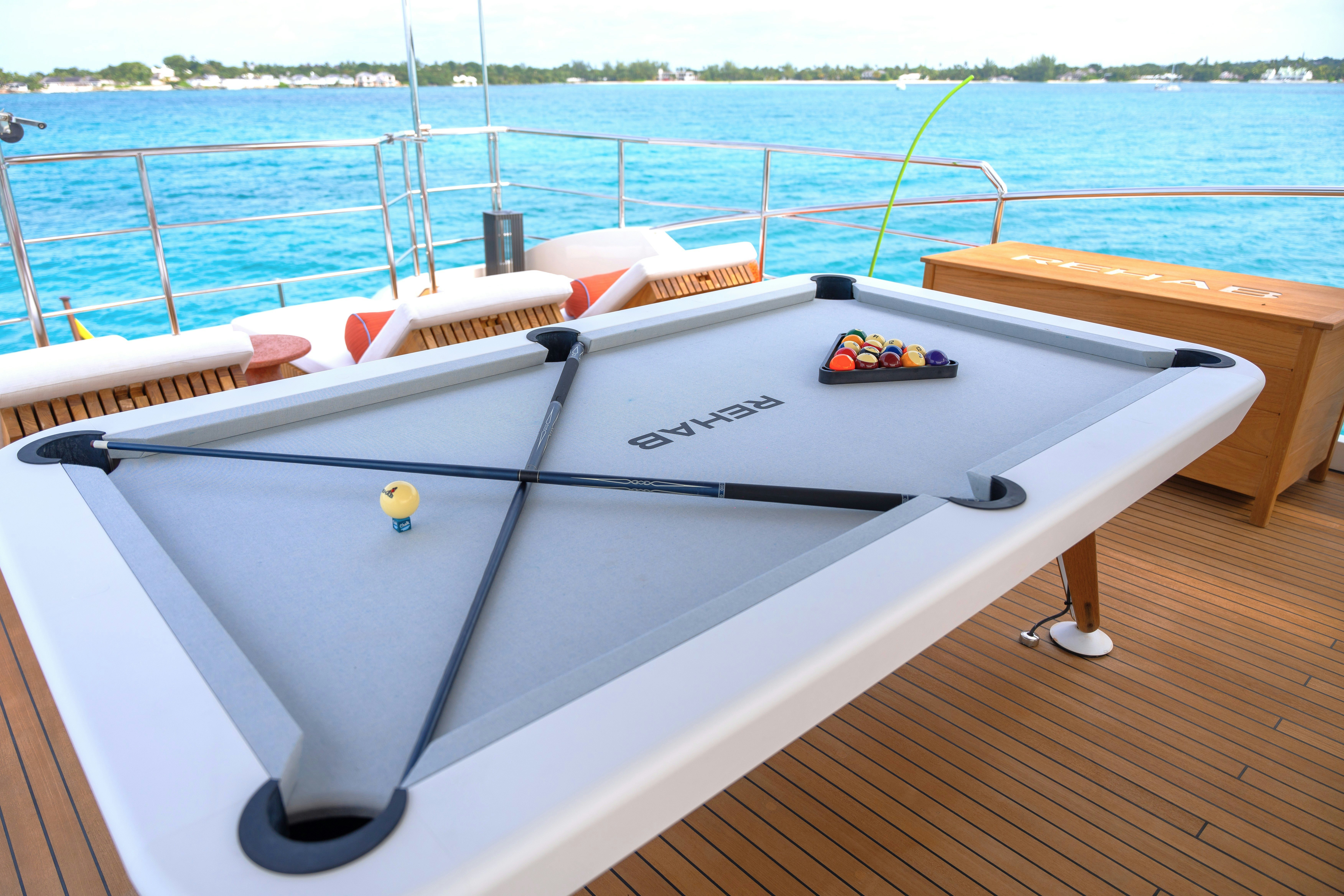 a boat on a deck aboard REHAB Yacht for Sale