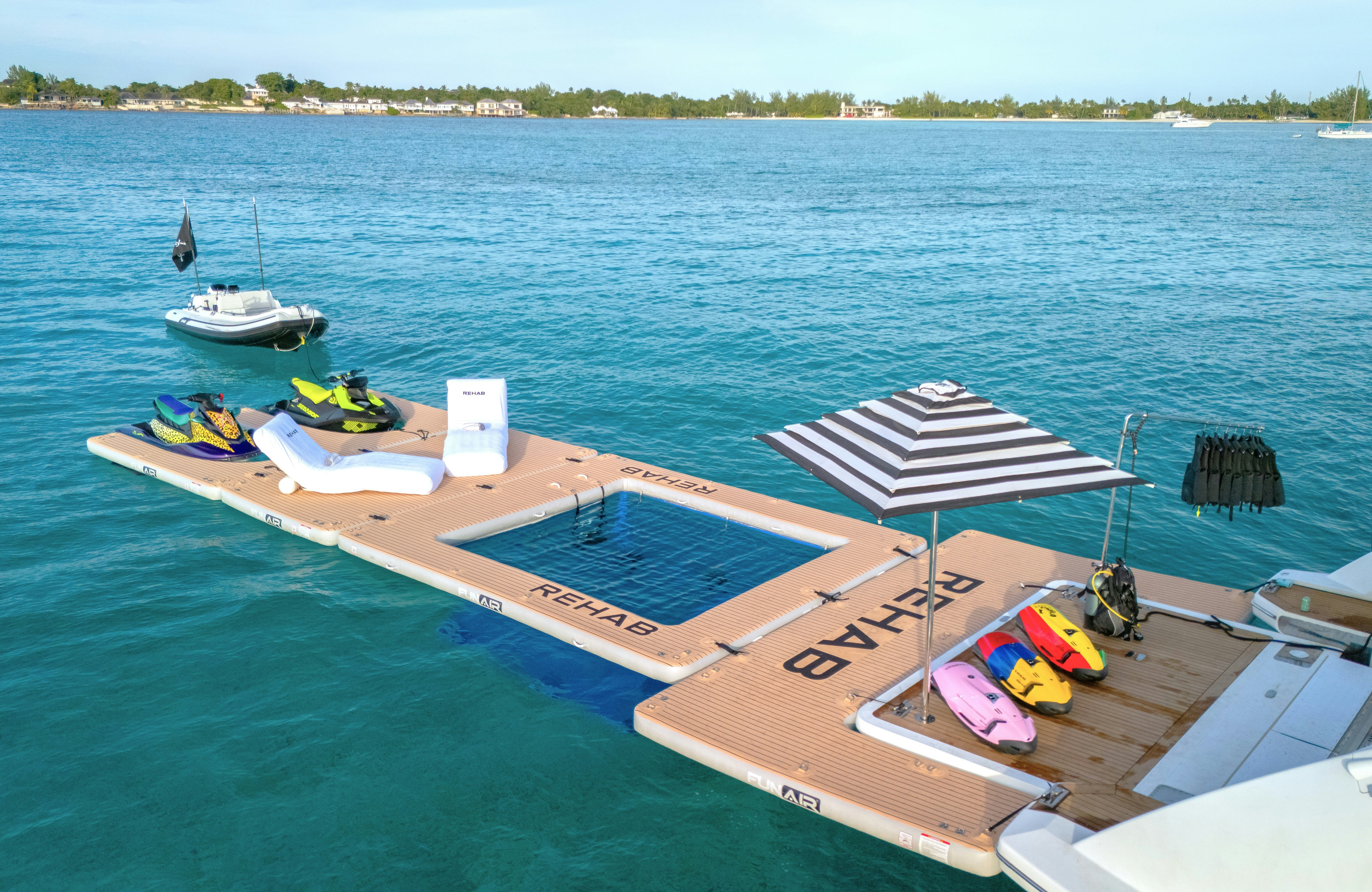 a dock with boats on it aboard REHAB Yacht for Sale