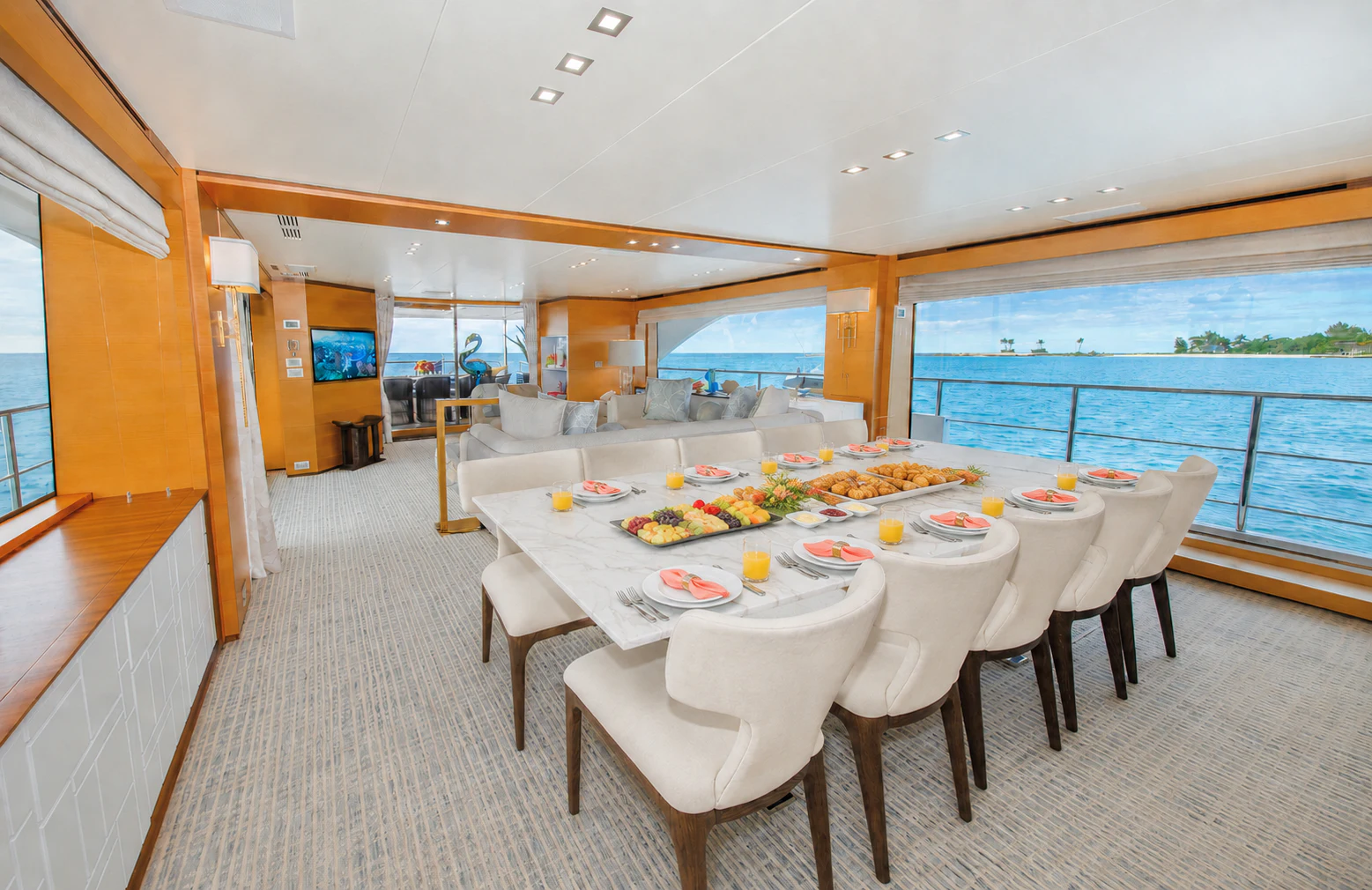 a dining room with a large window aboard REHAB Yacht for Sale