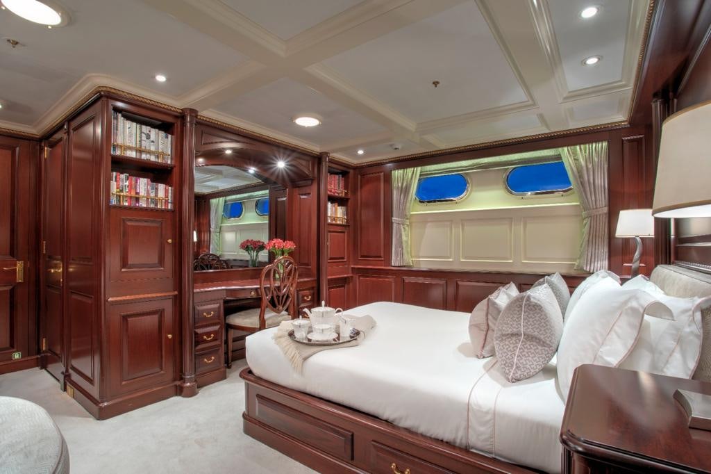 a living room with a couch and a table aboard TELEOST Yacht for Charter