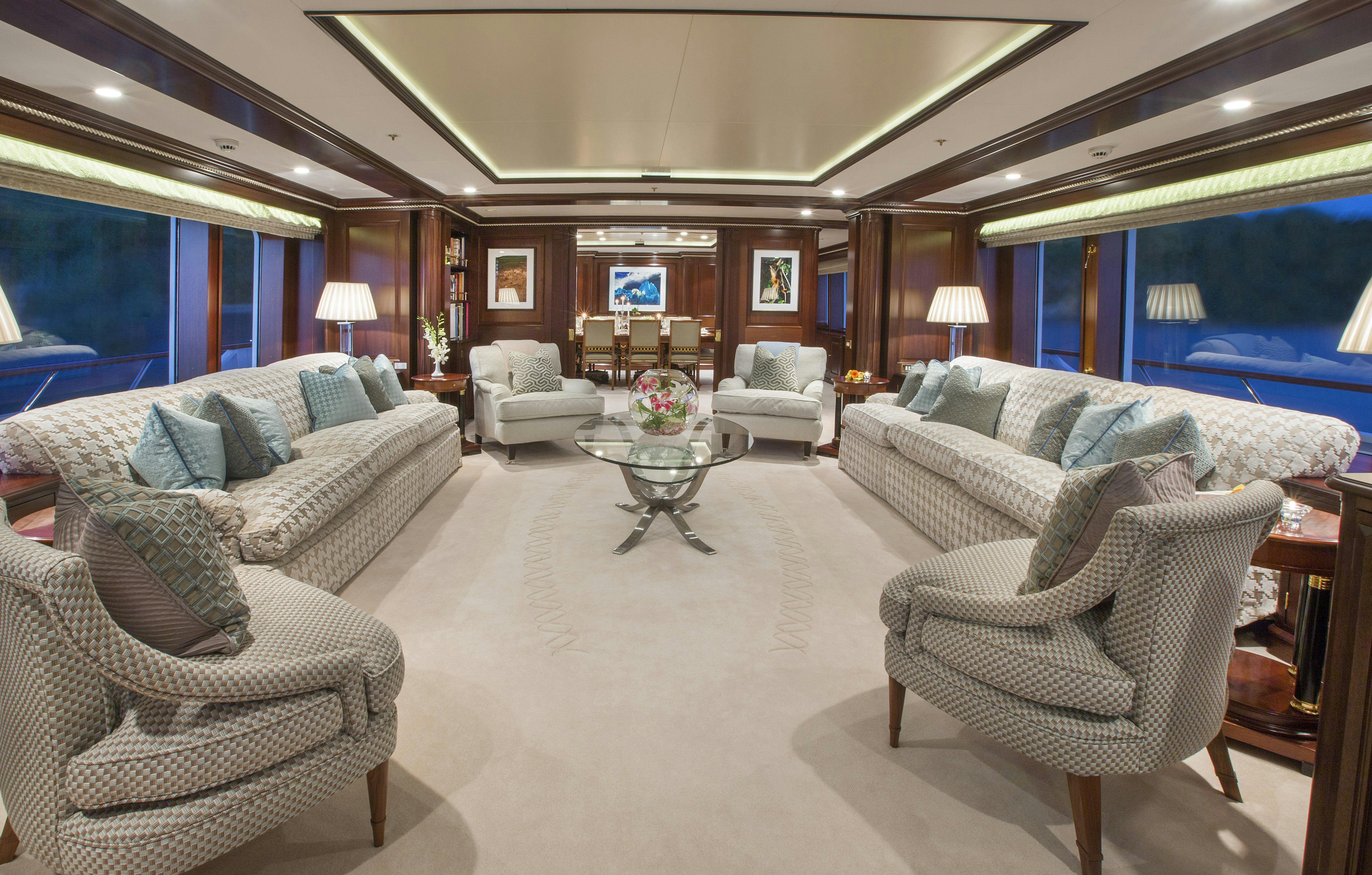 a living room with a large window aboard TELEOST Yacht for Charter