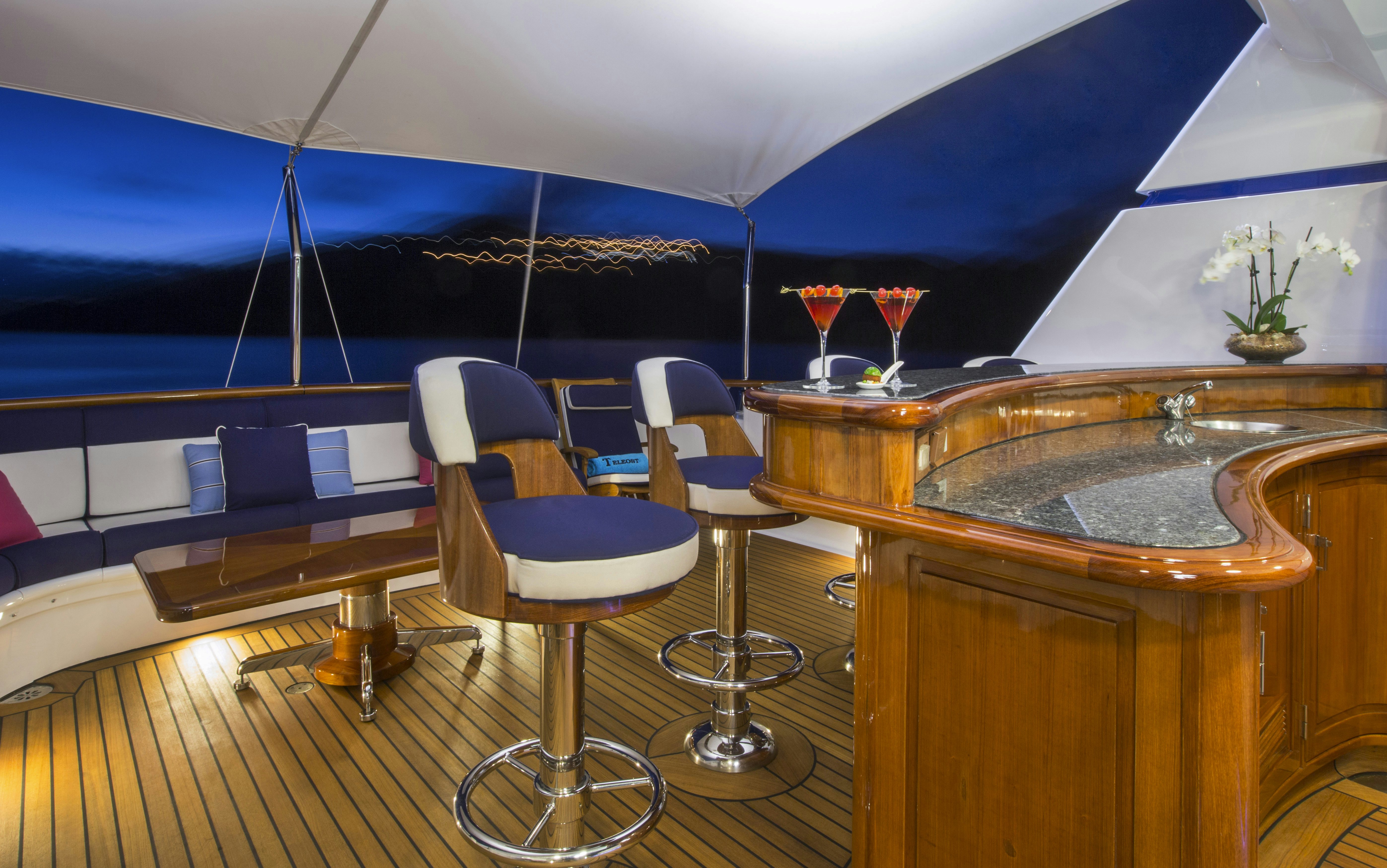 a room with a table and chairs aboard TELEOST Yacht for Charter